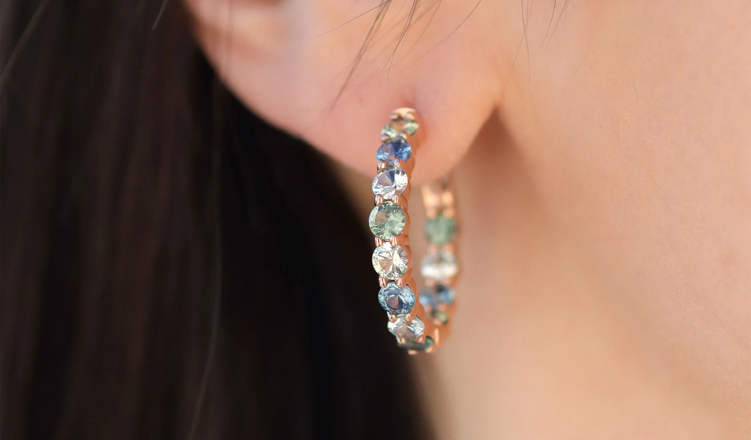 <p>Katerina Perez wears a pair of Le Vian hoop earrings set with Montana Sapphire Ombré™</p>