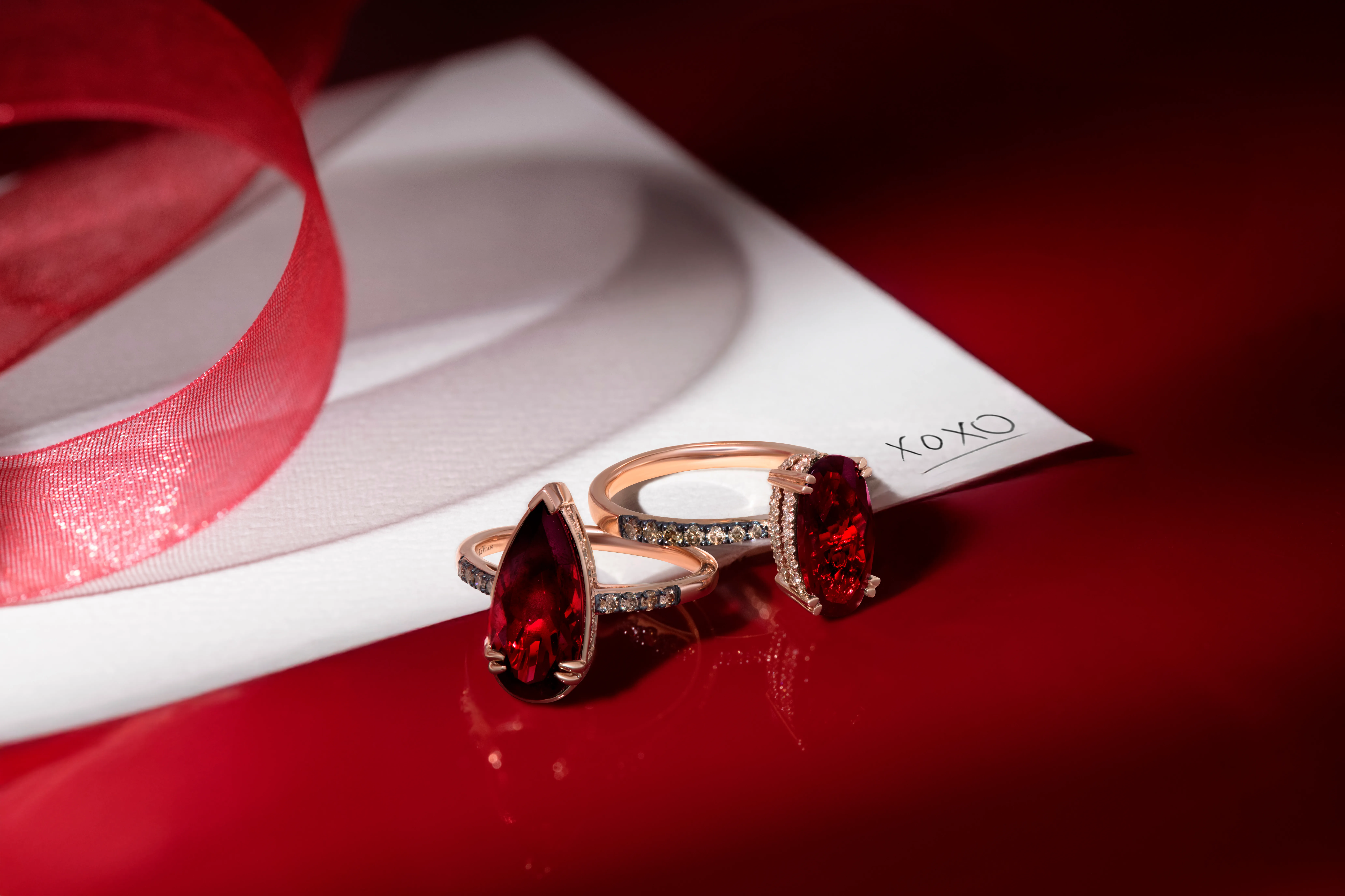 <p>Le Vian Hidden Halo Pomegranate Garnet™ and Chocolate Silhouette® rings </p>