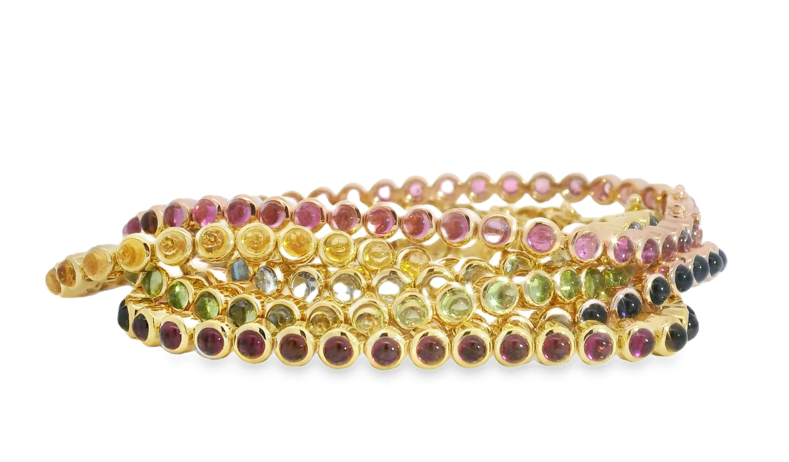 <p>Lisa Nik Rainbow bracelets, set with aquamarine, citrine, peridot, pink tourmaline, rhodolite garnet and iolite in 18k yellow gold</p>
