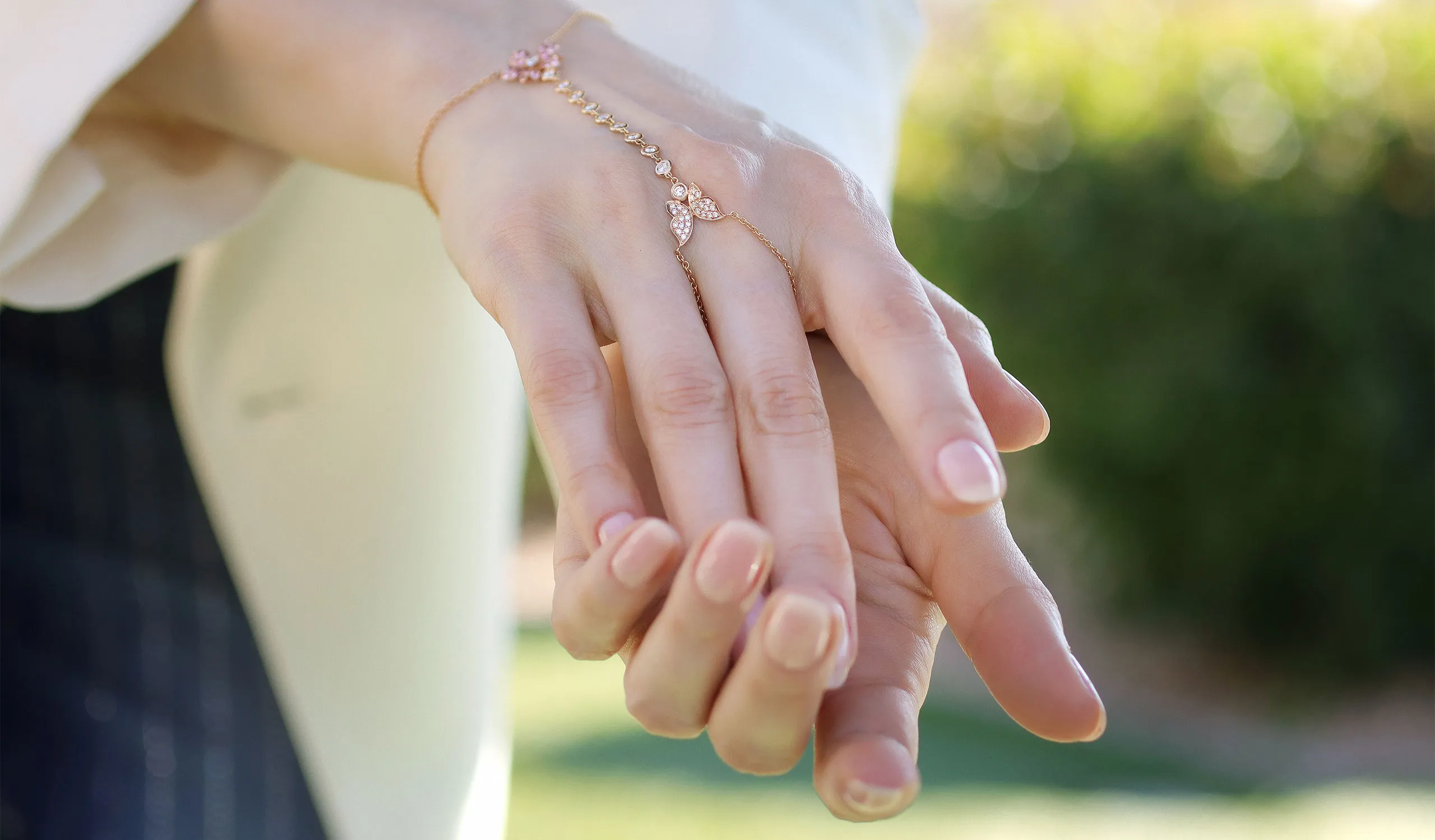 <p>Katerina Perez spotlights a Lisa Nik hand chain from the Rainbow collection, set with pink sapphires and diamonds in 18k rose gold</p>
