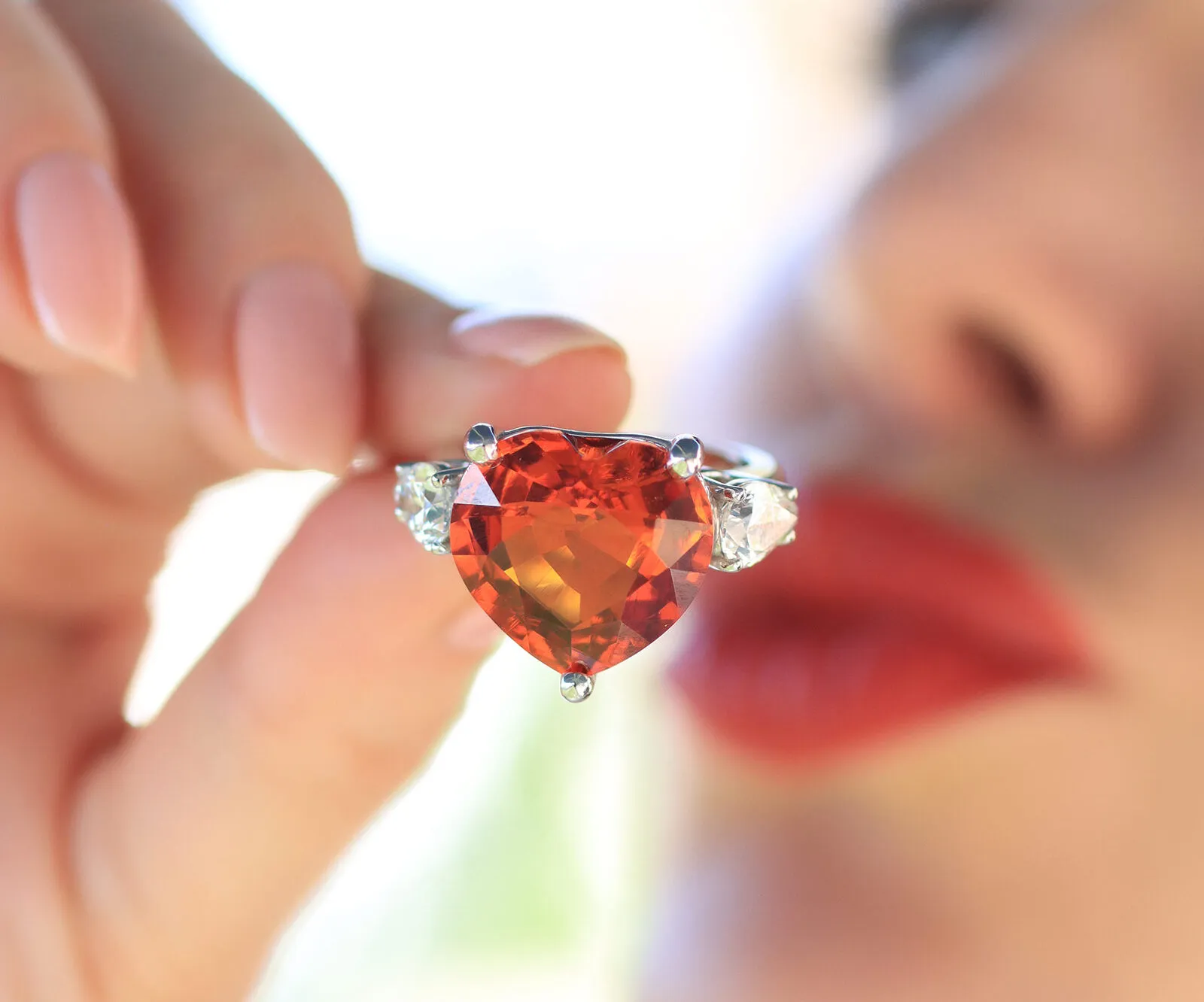 <p>Lisa Nik 20-carat heart-shaped mandarin garnet ring with two pear-shaped diamond accents, set in 18k gold </p>
