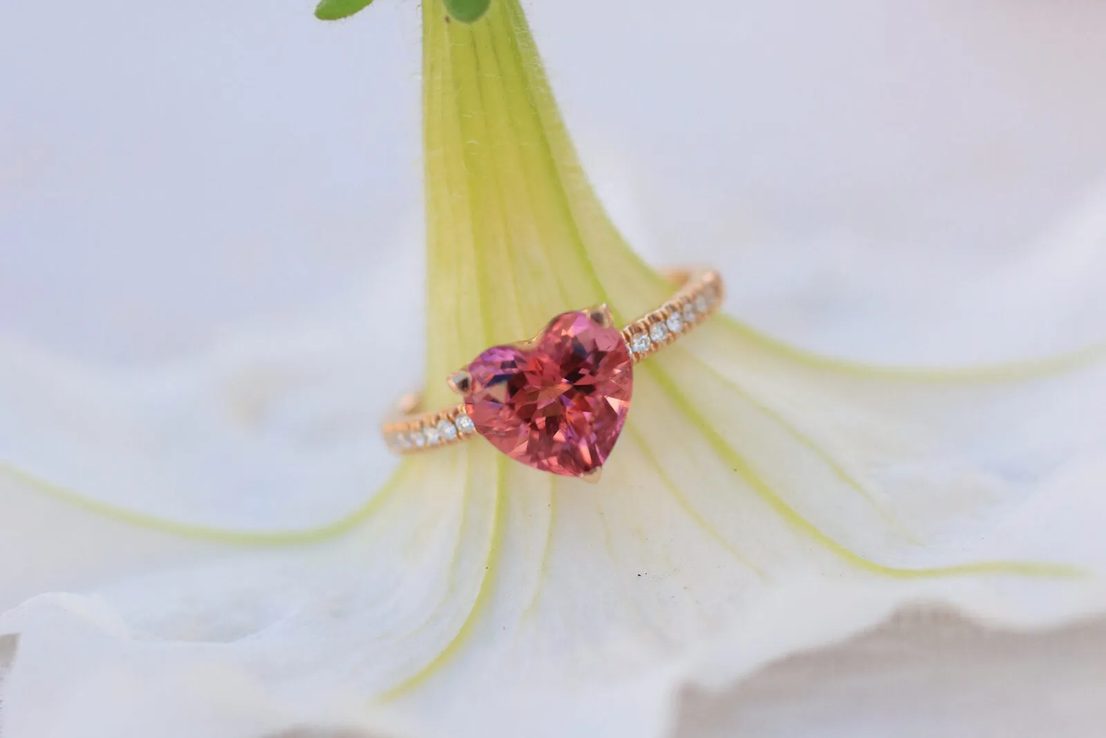<p>A heart-shaped pink tourmaline ring with diamond-set shoulders in 18k rose gold by Lisa Nik</p>
