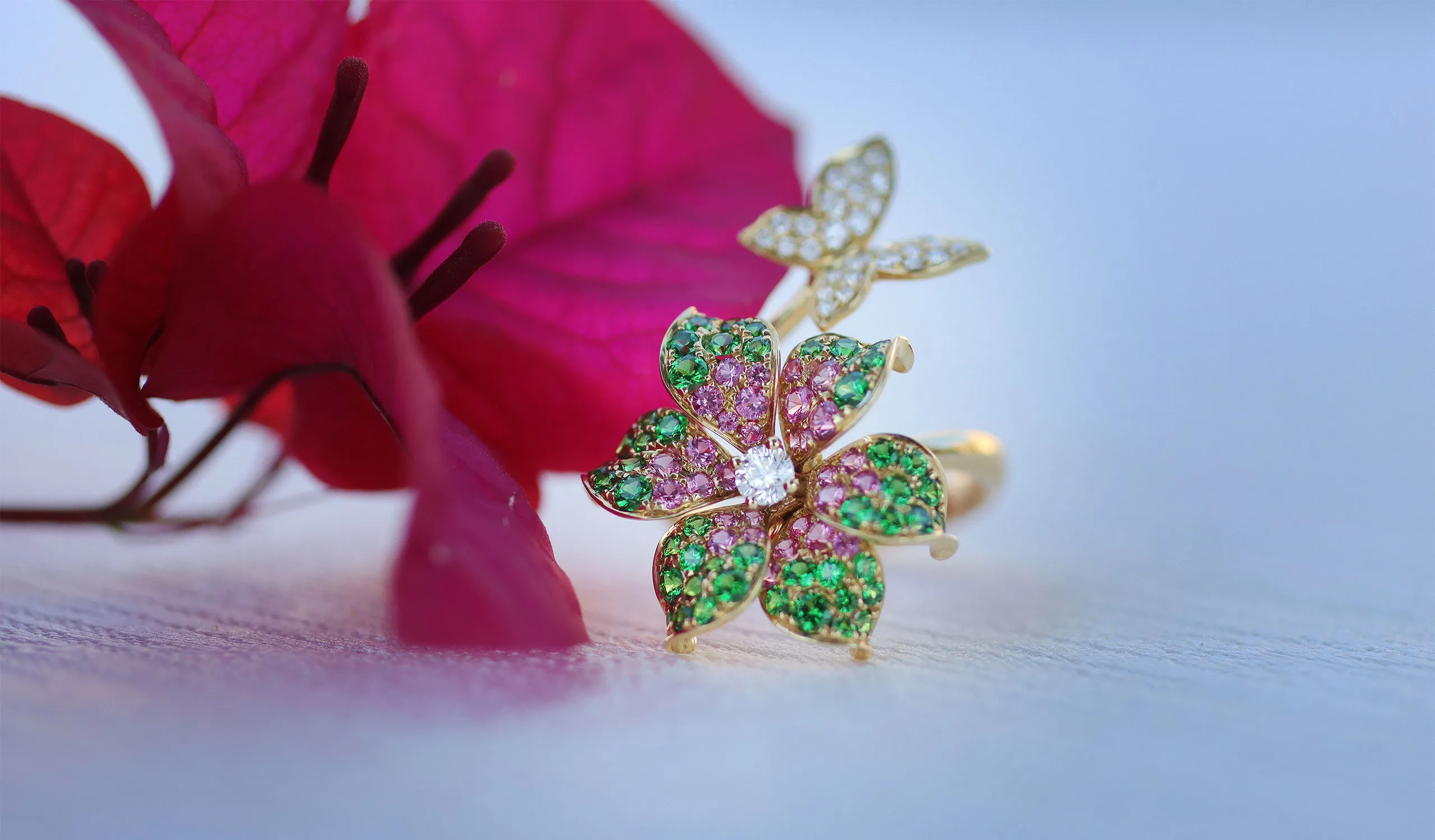 <p>Lisa Nik Butterfly Flower ring from the Rainbow collection, set with tsavorite garnets, pink sapphires and diamonds in 18k yellow gold</p>
