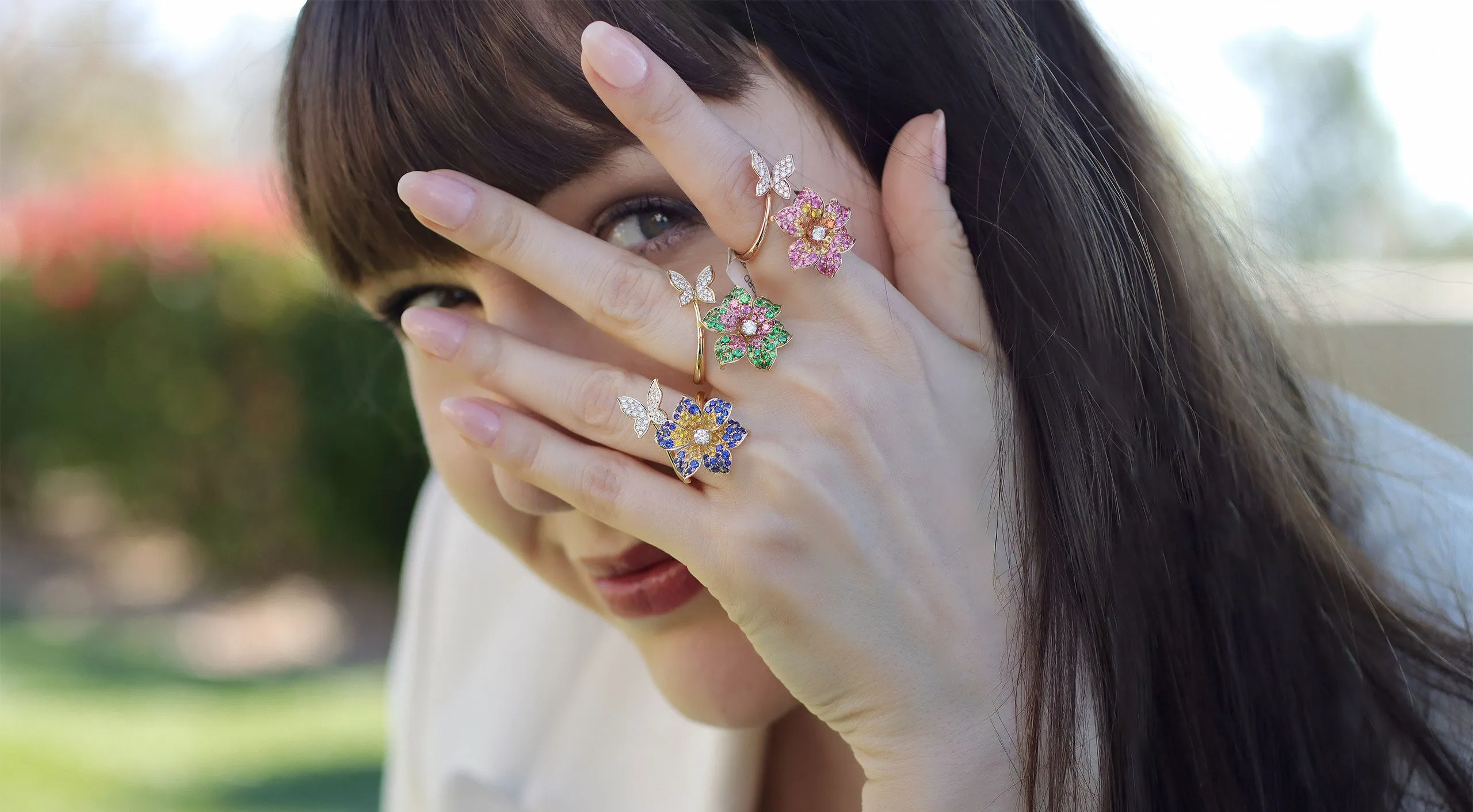 <p>Katerina Perez wears Butterfly Flower rings from the Lisa Nik Rainbow collection, featuring blue sapphires, tsavorite garnets, pink sapphires and diamonds set in 18k rose and yellow gold</p>
