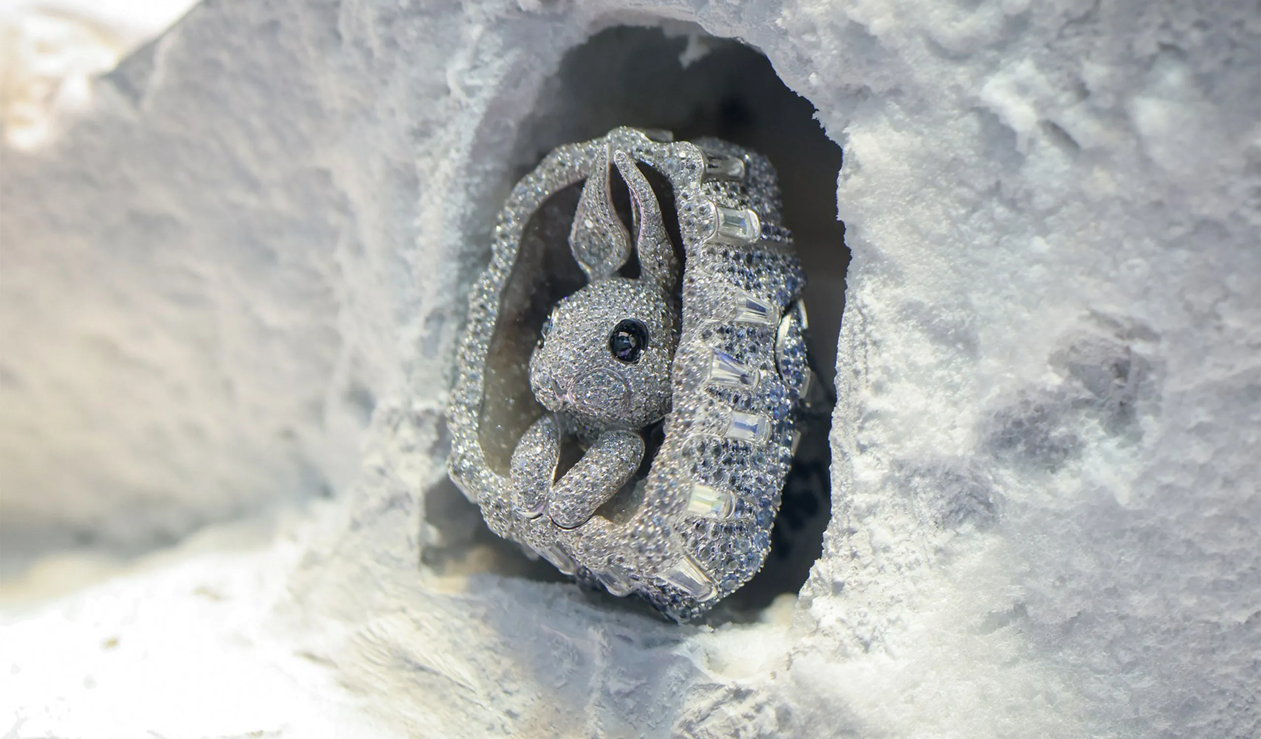 <p>A bunny peeks out of his icy diamond and sapphire burrow in this White Paradise high jewellery ring</p>
