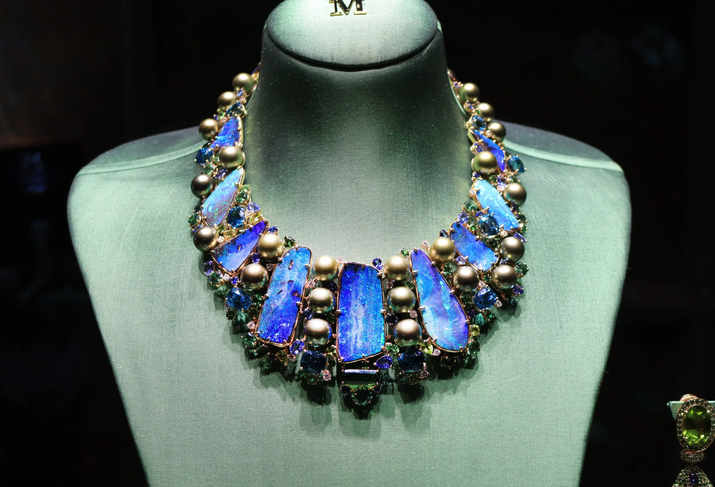 <p>Margot McKinney Atoll collier with 253.16 carats of Australian boulder opals, pistachio pearls, green and blue tourmalines, diamonds, blue sapphires, tsavorites, peridots, zircons and demantoids, set in 18k yellow gold</p>
