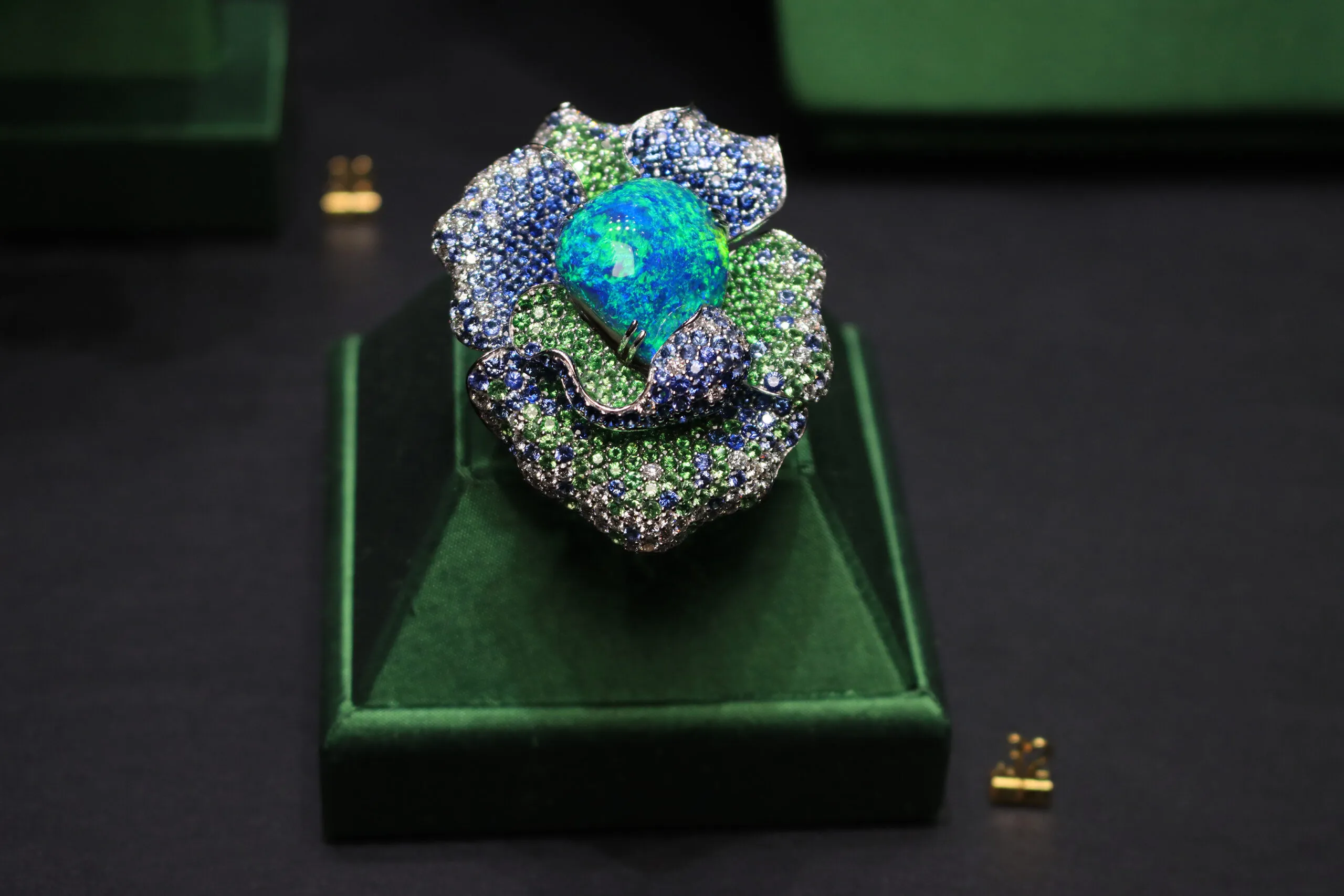 <p>Margot McKinney Rainforest Bloom ring with a 37.52 carat Australian black opal, diamonds, blue sapphires and tsavorites, set in 18k white gold</p>
