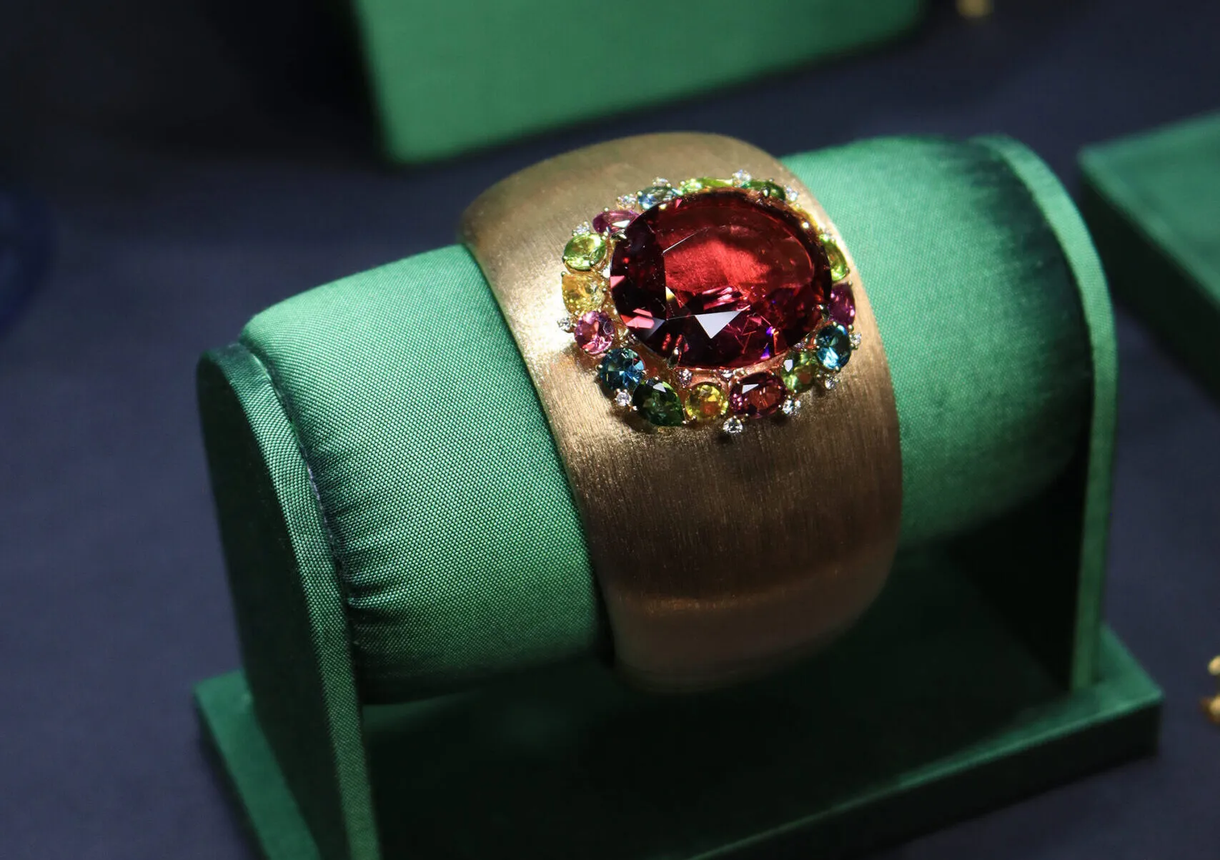 <p>Margot McKinney Begonia cuff with a 32.97 carat rubellite, diamonds, yellow sapphires, green tourmalines, peridots, rhodolites and blue topazes set in 18k brushed yellow gold </p>
