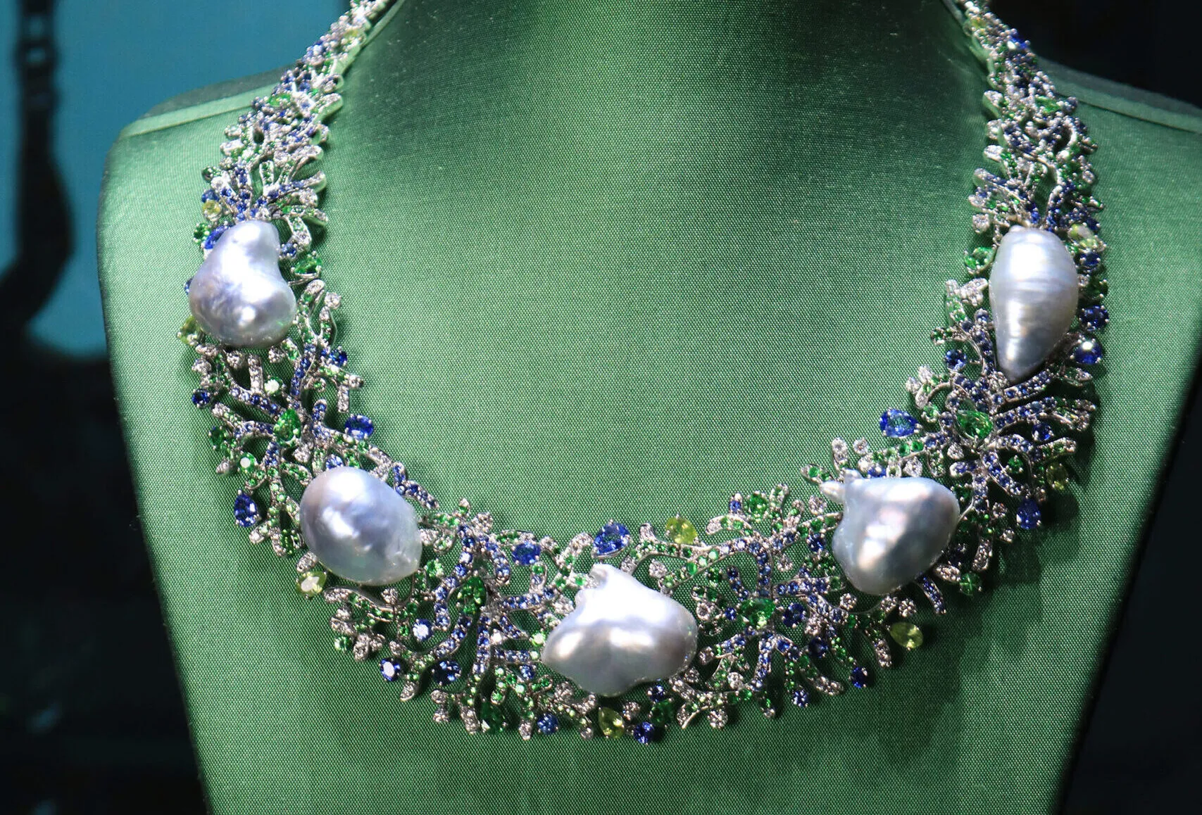 <p>Margot McKinney Coral collier with Australian South Sea baroque pearls, diamonds, blue sapphires, tsavorites and peridots, set in 18k white gold</p>
