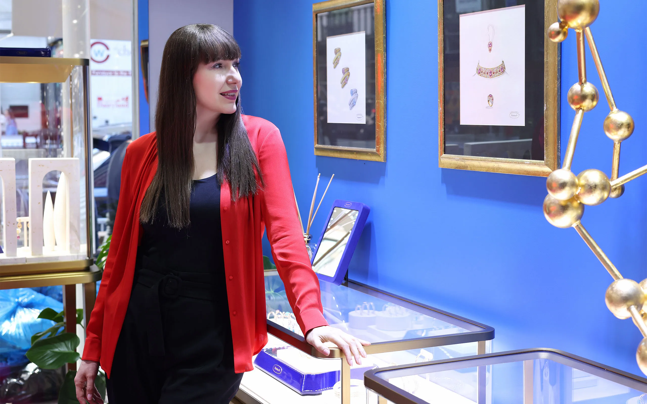 <p>Royal blue walls wrap the boutique in bold colour</p>
