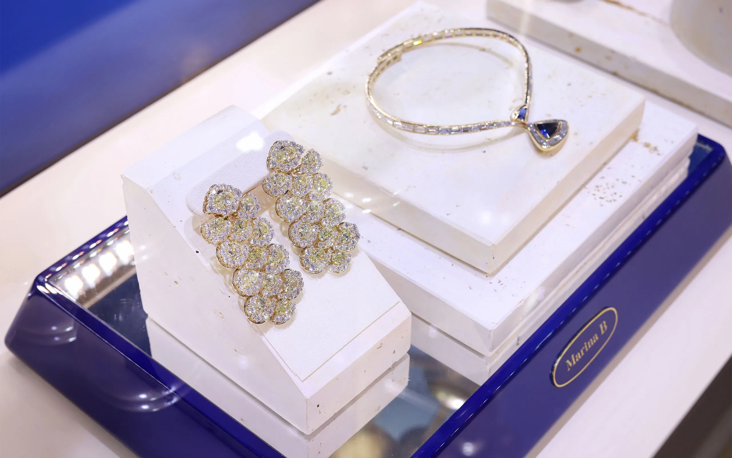 <p>A display of high jewellery at the Marina B boutique: the transformable Girasole earrings and Antilope necklace</p>
