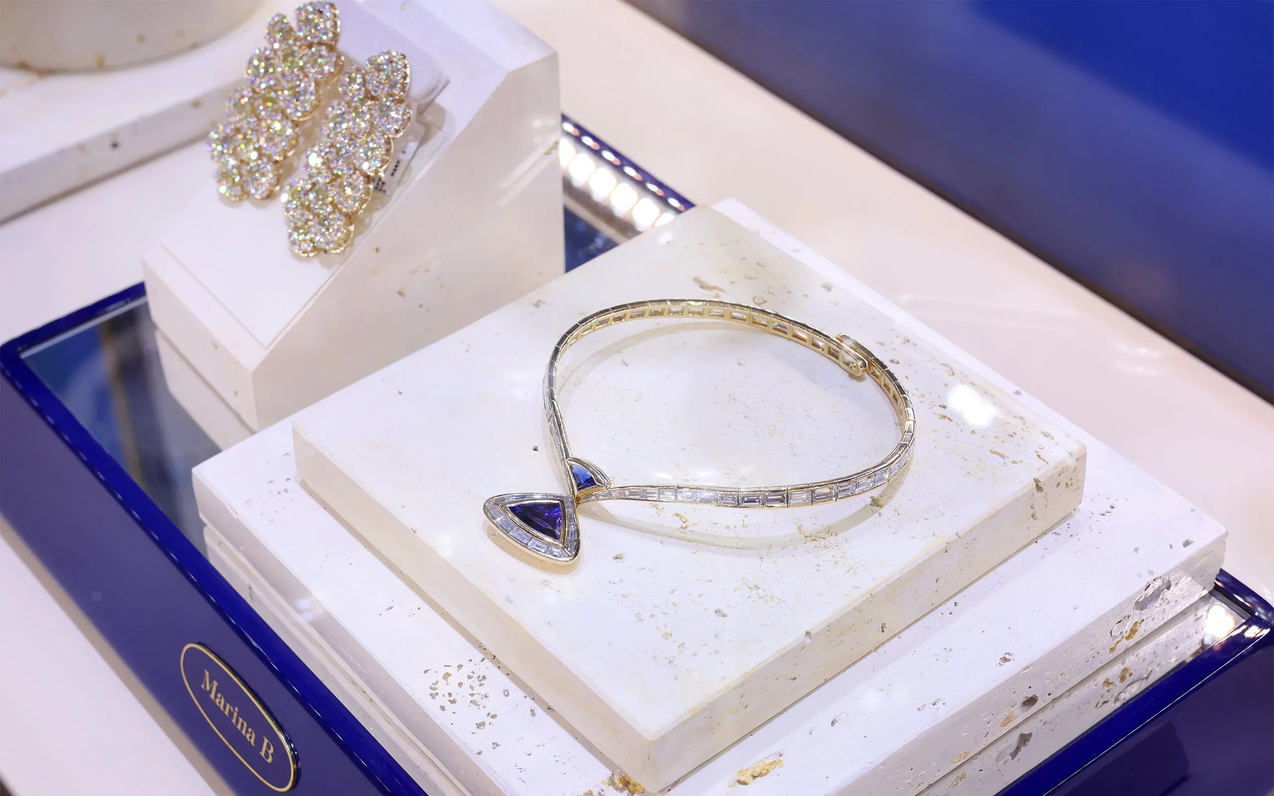 <p>The transformable Antilope high jewellery necklace by Marina B, with a detachable triangular step-cut Ceylon sapphire and diamond pendant in 18k yellow gold</p>
