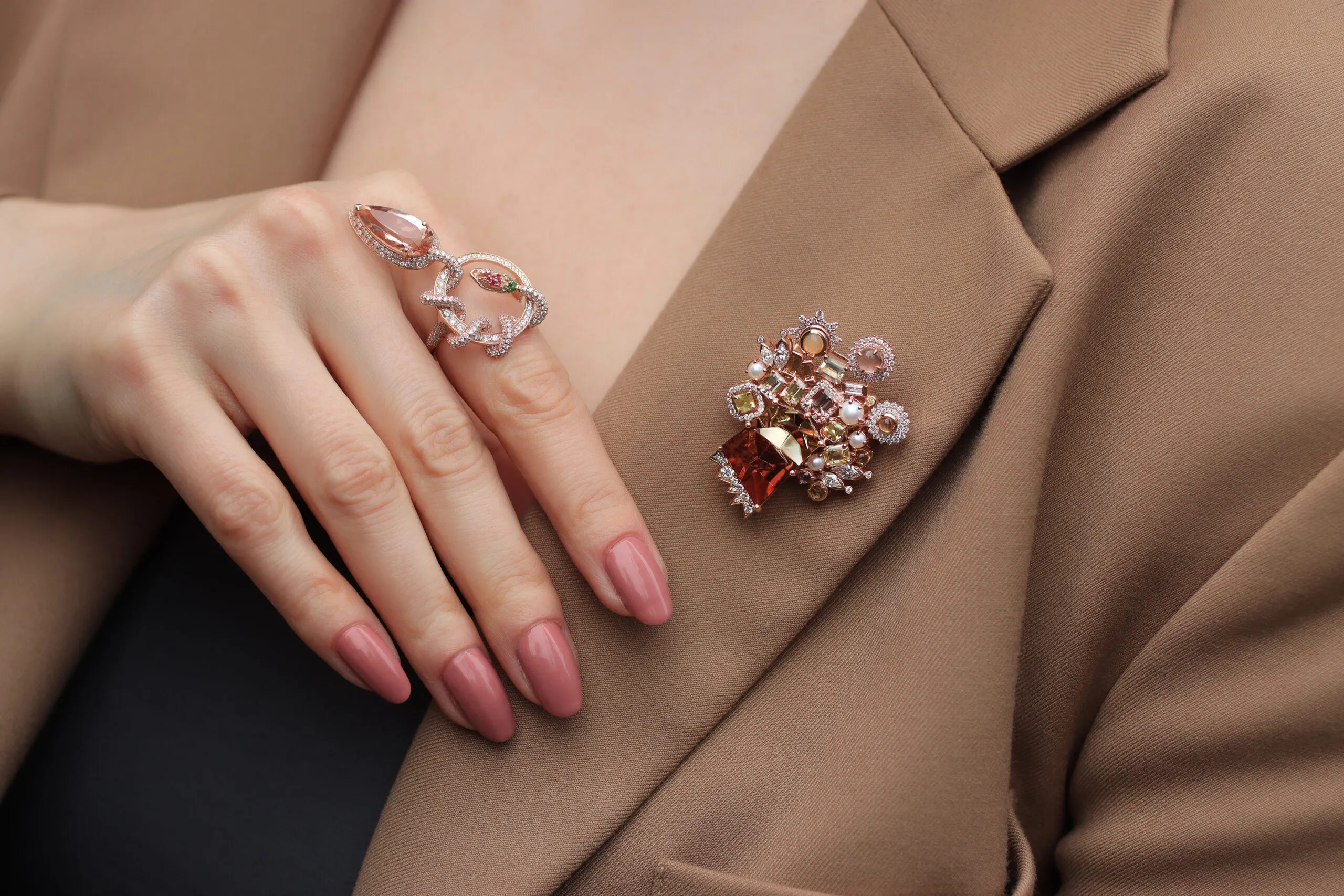 <p>Katerina Perez wears the Mariyeh Ghelichkhani Tree of Life brooch with a 13-carat tourmaline, pastel-coloured sapphires, diamonds and pearls, alongside the Serpent’s Embrace ring with a pear-shaped morganite and diamonds, both in 18k rose gold </p>
