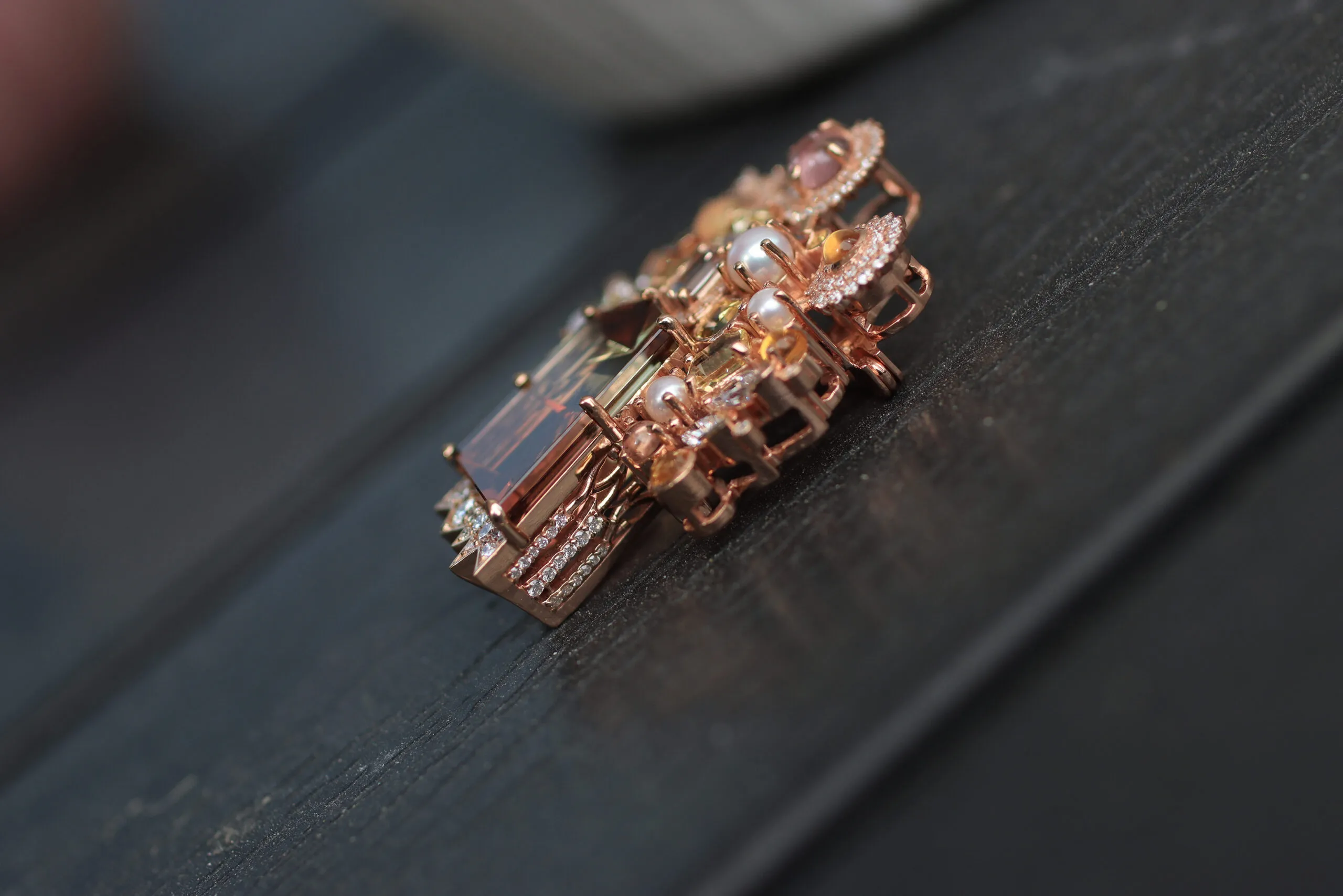 <p>A side view of the Mariyeh Ghelichkhani Tree of Life brooch-pendant with a 13-carat tourmaline, pastel-coloured sapphires, diamonds and pearls set in 18k rose gold </p>

