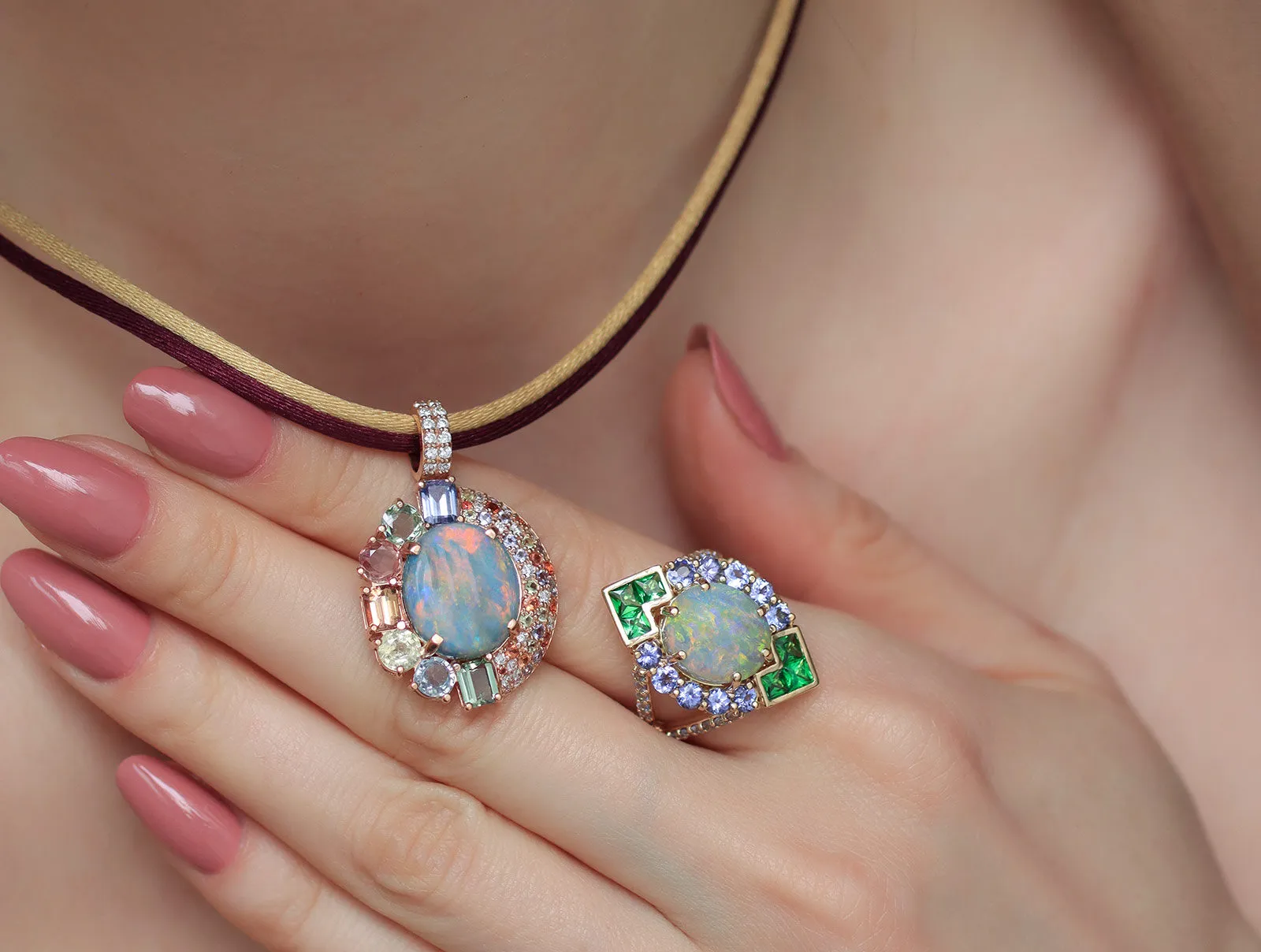 <p>A closer look at the Mariyeh Ghelichkhani Twilight Splendour pendant with an Australian opal, sapphires, diamonds and tanzanite, and the Angels Fall ring with Australian opal, tsavorites and tanzanites, both in 18k yellow gold</p>
