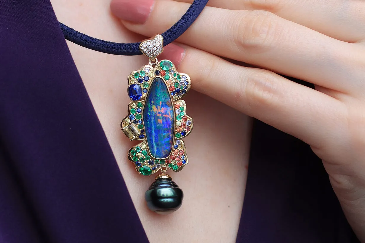 <p>Mariyeh Ghelichkhani Dew Drop in Twilight pendant with an Australian boulder opal, sapphires, emeralds, tanzanites, and a Tahitian pearl drop</p>
