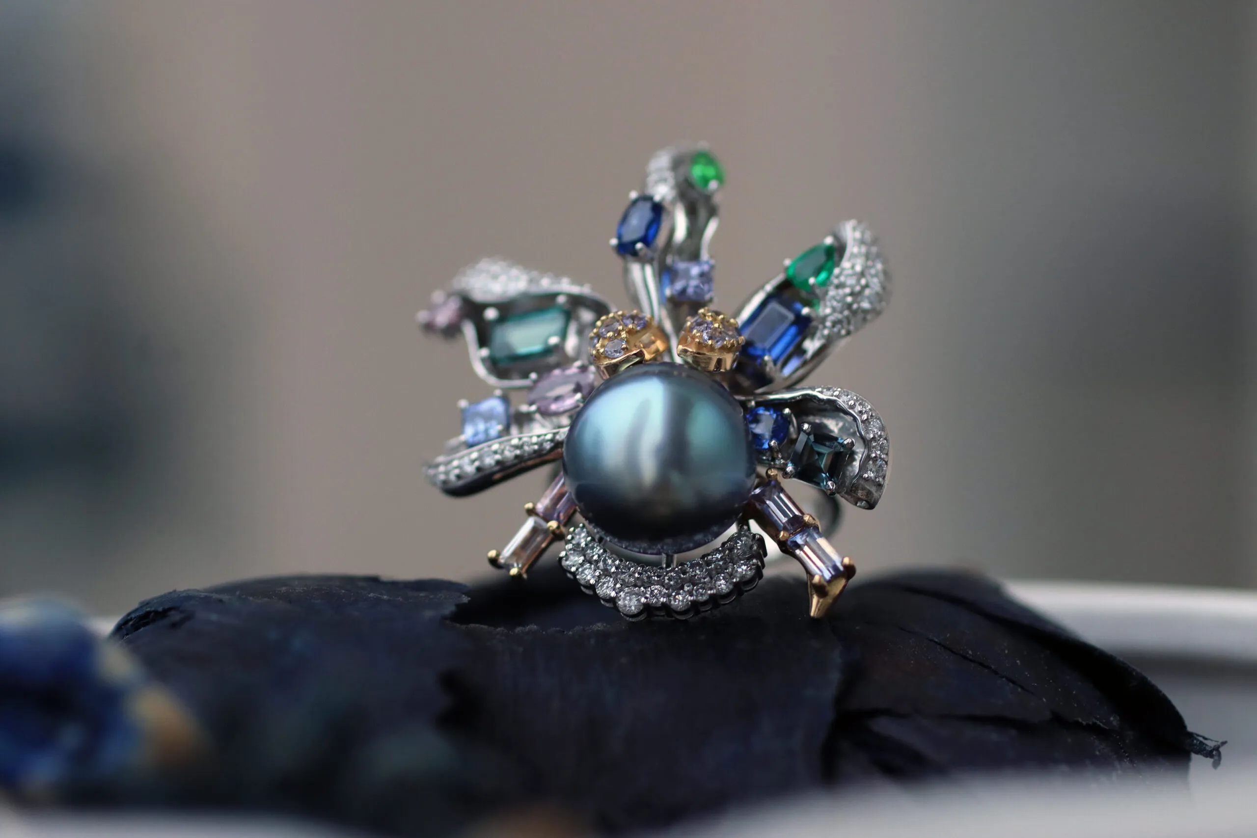 <p>Mariyeh Ghelichkhani Aqua ring from The Orchid collection with a Tahitian pearl, tourmalines, emeralds, sapphires, tanzanites and diamonds, set in 18k white gold to resemble the petals of a flower</p>
