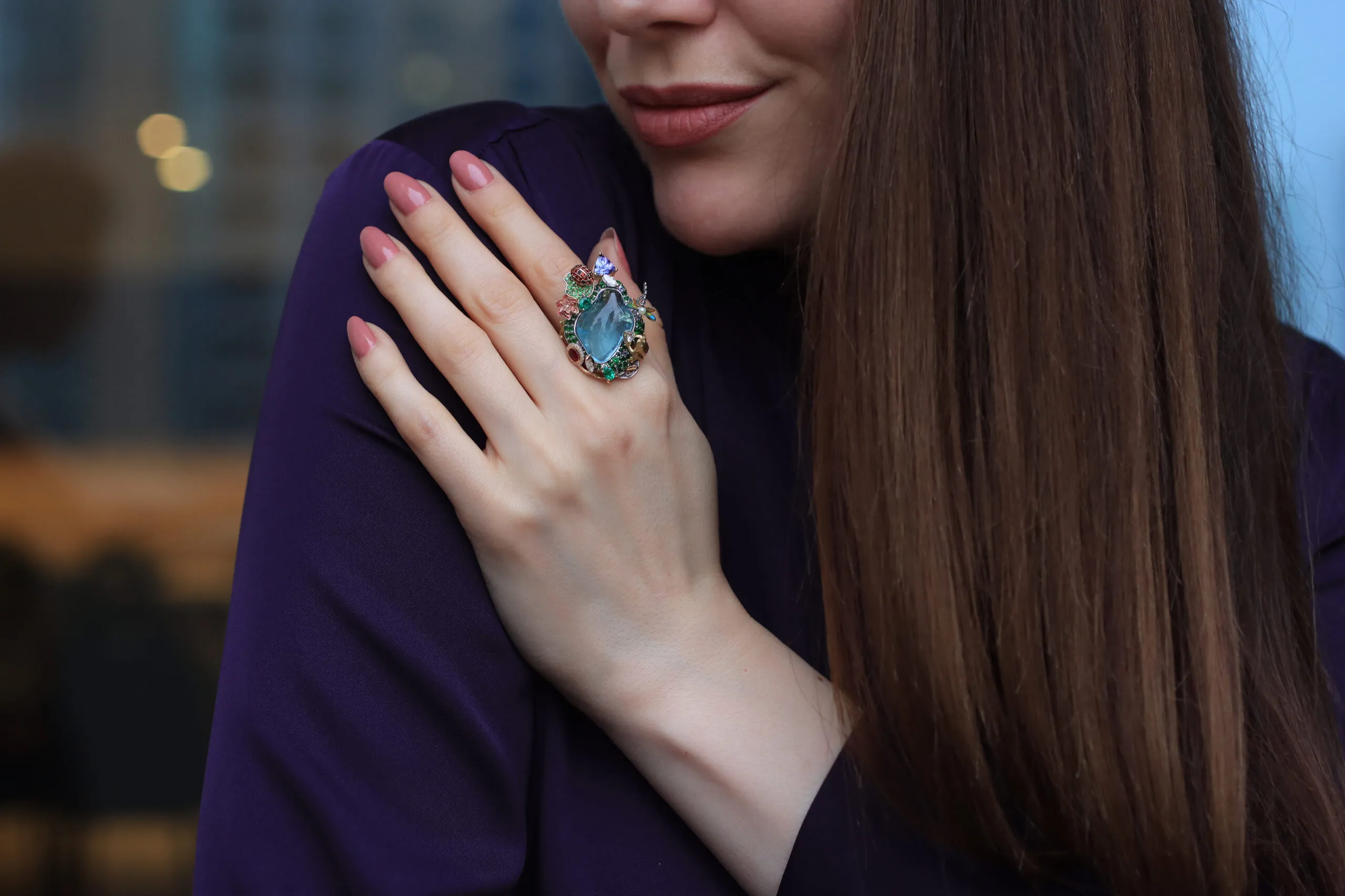 <p>Katerina Perez wears the Hayat ring by Mariyeh Ghelichkhani with a 22-carat aquamarine surrounded by multi-coloured gemstones and diamonds in 18k gold </p>
