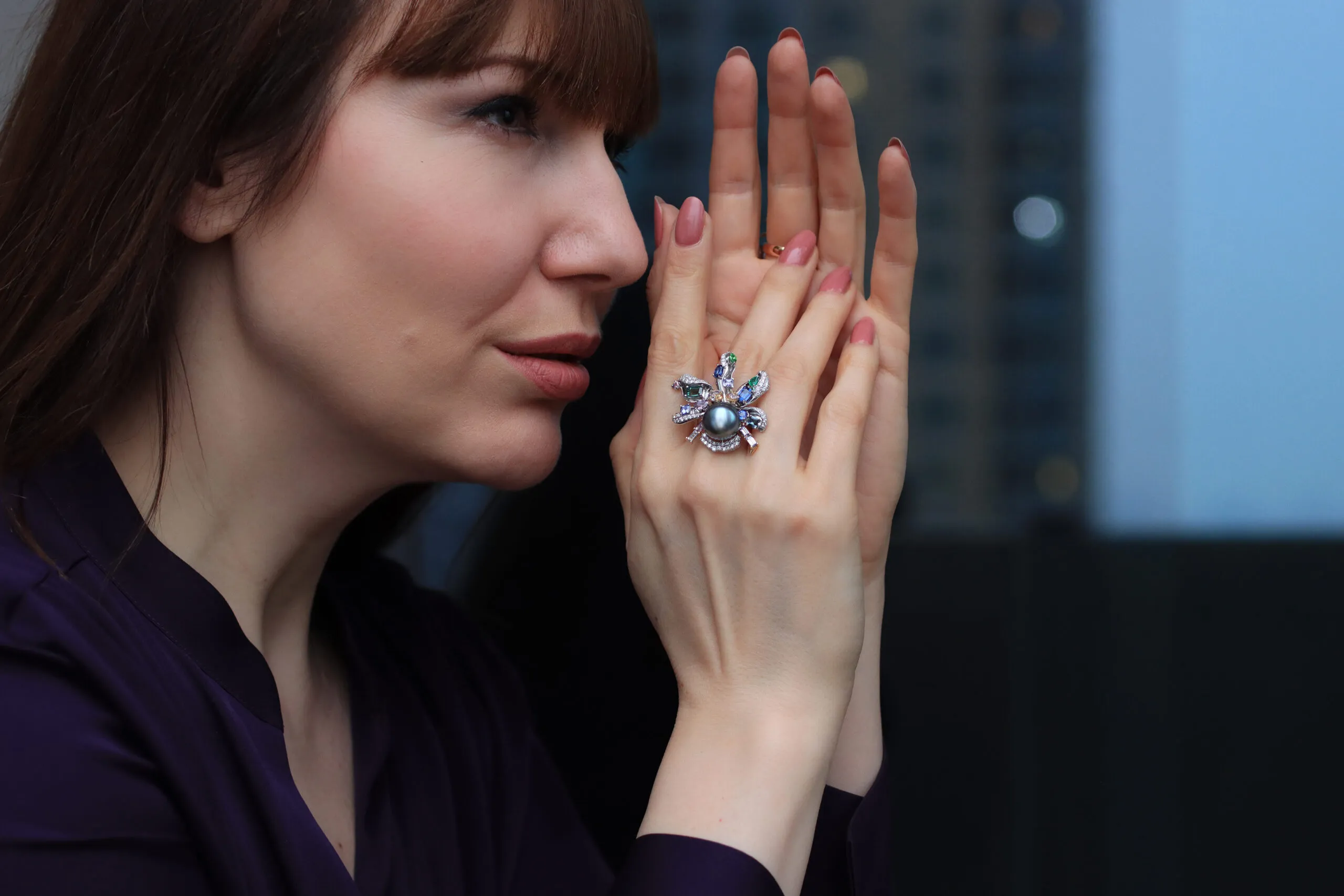 <p>Katerina Perez wears the Mariyeh Ghelichkhani Aqua ring from The Orchid collection with a Tahitian pearl, tourmalines, emeralds, sapphires, tanzanites and diamonds, set in 18k white gold </p>
