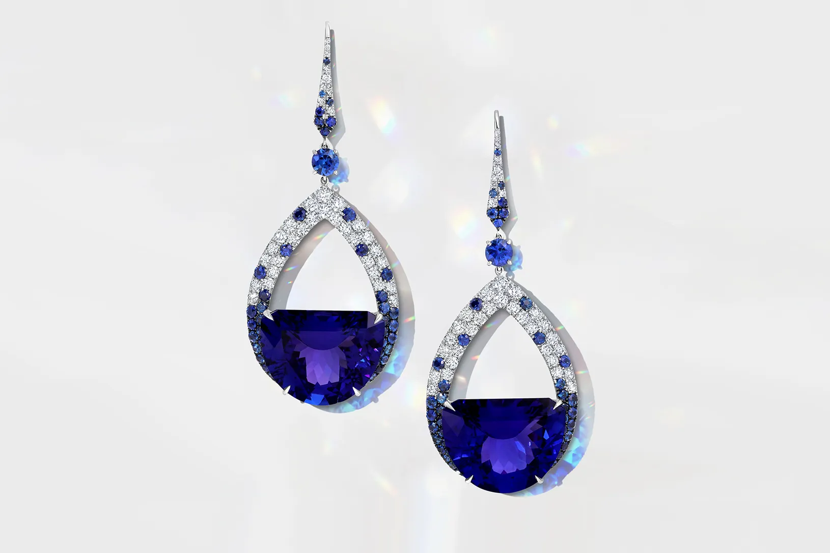 <p>Martin Katz Half Moon tanzanite earrings with specially-cut half moon tanzanites accented with round diamonds and sapphires in 18k white gold ©martinkatzjewels</p>
