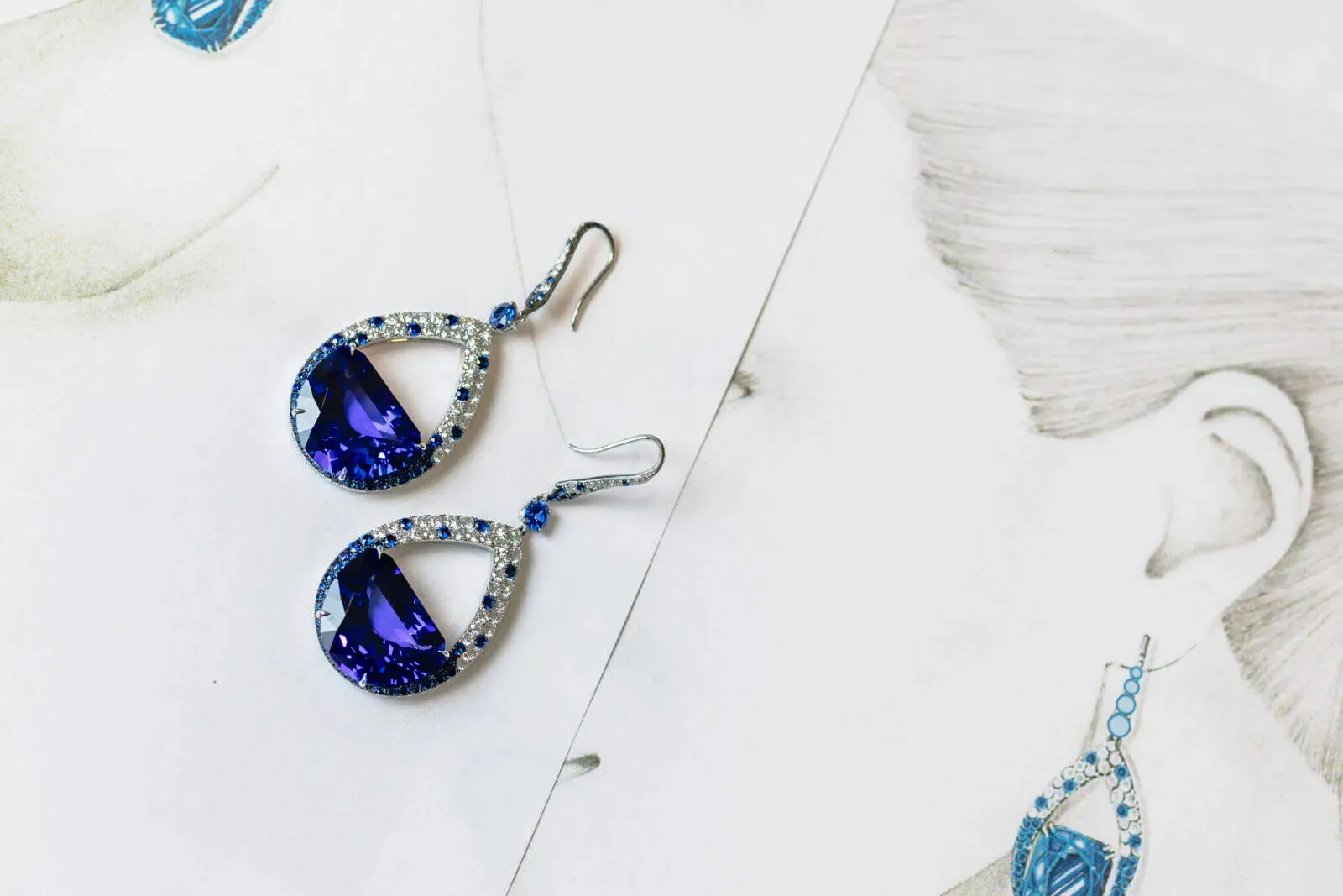 <p>Martin Katz Half Moon tanzanite earrings with specially-cut half moon tanzanites accented with round diamonds and sapphires in 18k white gold ©martinkatzjewels</p>
