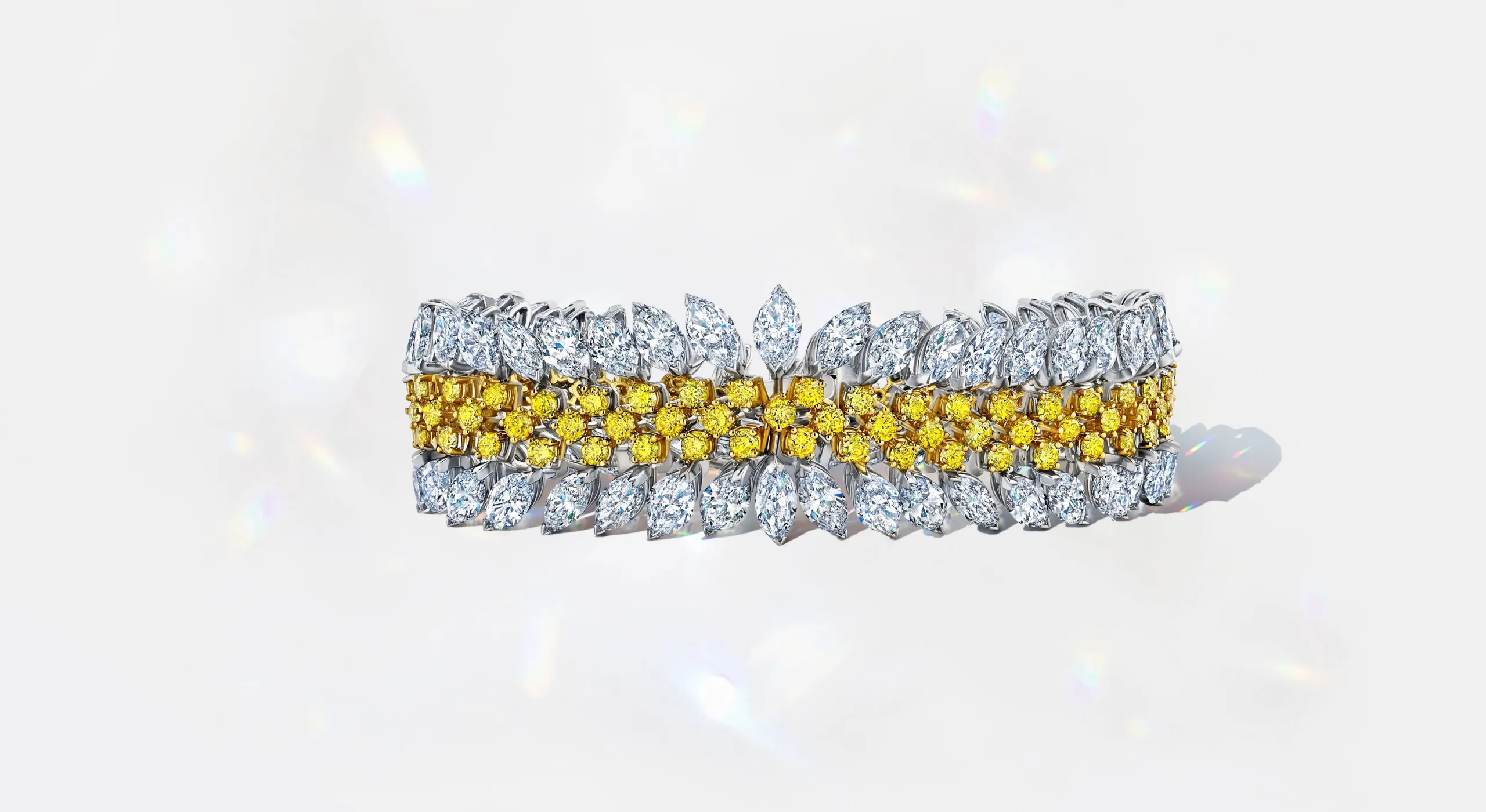 <p>Martin Katz fancy vivid yellow and white diamond bracelet, set with 122 round diamonds and 81 marquise diamonds in 18k yellow and white gold ©martinkatzjewels</p>
