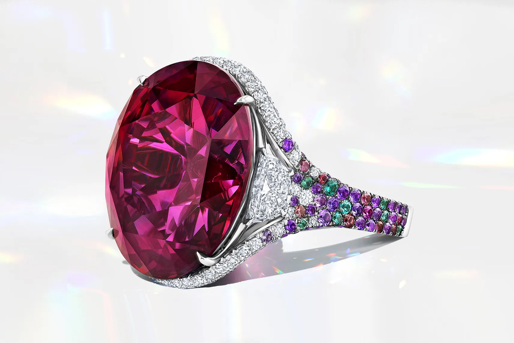 <p>Martin Katz right-hand ring with a 33-carat unheated bluish pink oval-shaped sapphire, accented by two half-moon diamonds and 319 micro-set gemstones, including lavender sapphires, amethysts, and colour change garnets</p>
