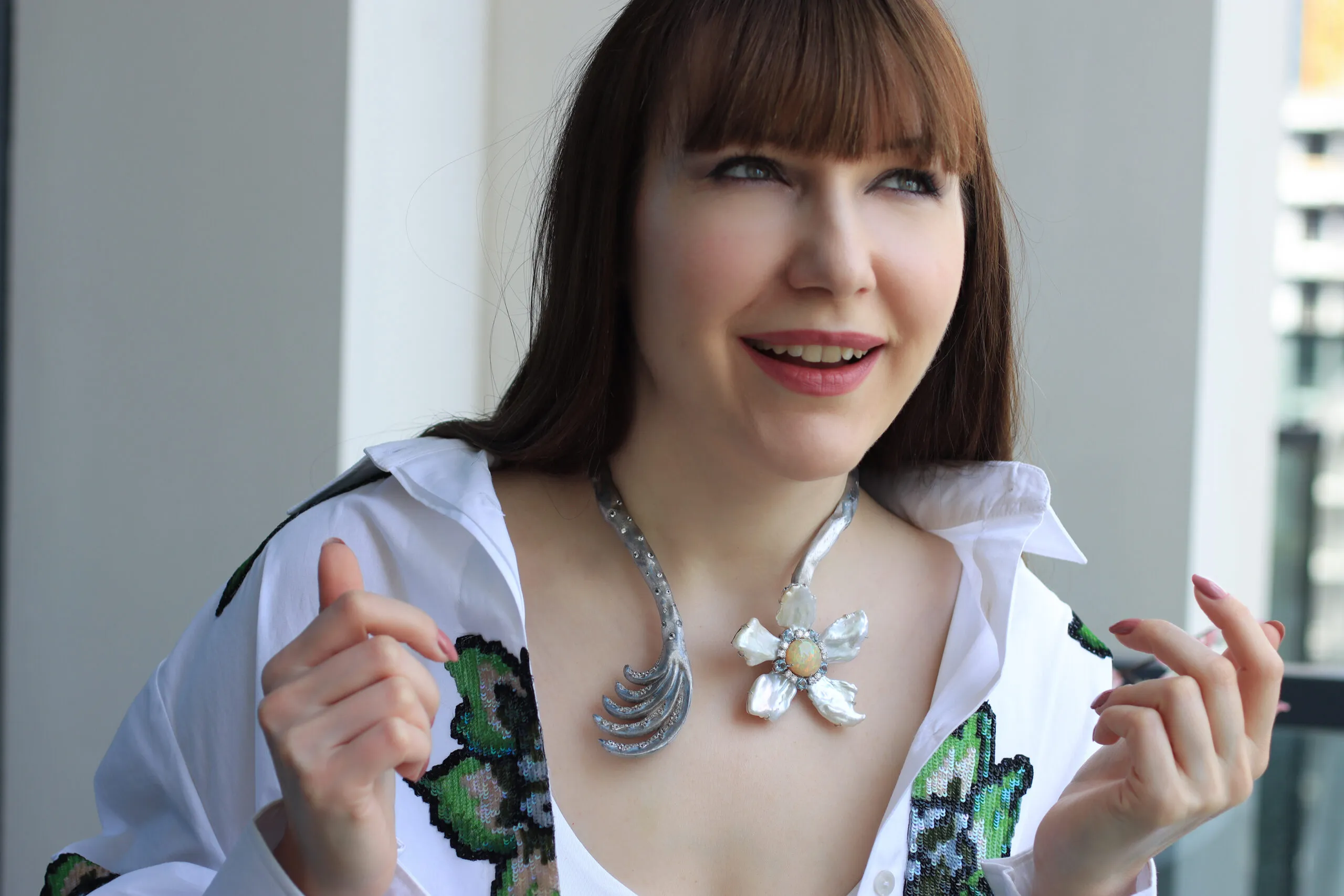 <p>Katerina Perez wears a Mergin Jewelry by Mehragin Rahmati necklace with diamonds, aquamarine, opal and pearls </p>
