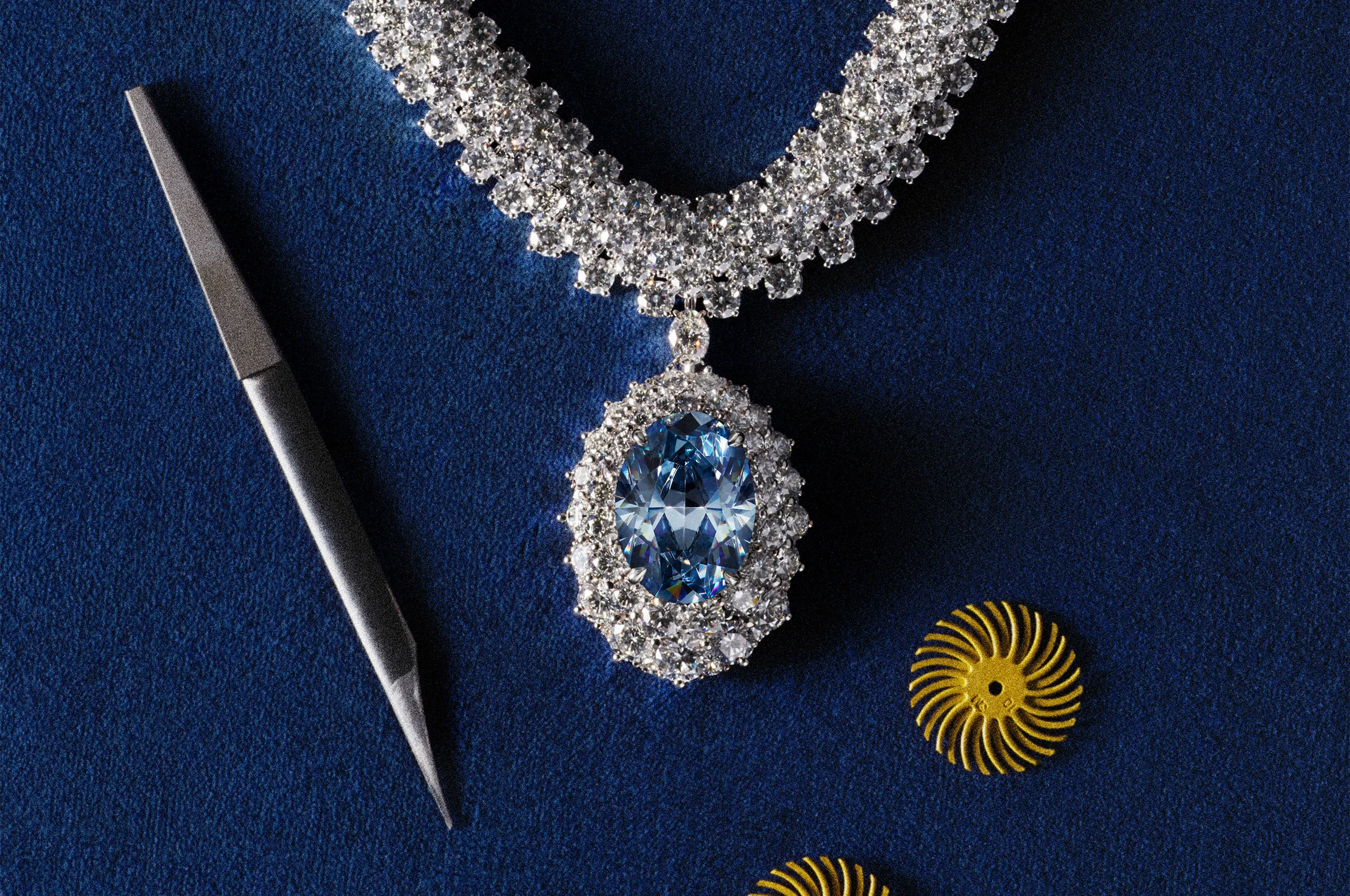 More than 500 white diamonds curve around the neckline in flowing ribbons that echo the waterways of the Okavango Delta