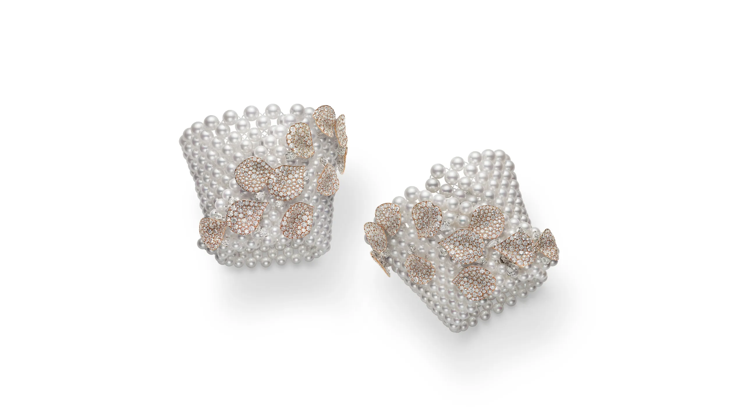 <p>A pair of Akoya cultured pearl cuff bracelets with more than 45 carats of diamonds set in 18k rose gold, part of the Mikimoto Les Pétales High Jewellery collection</p>