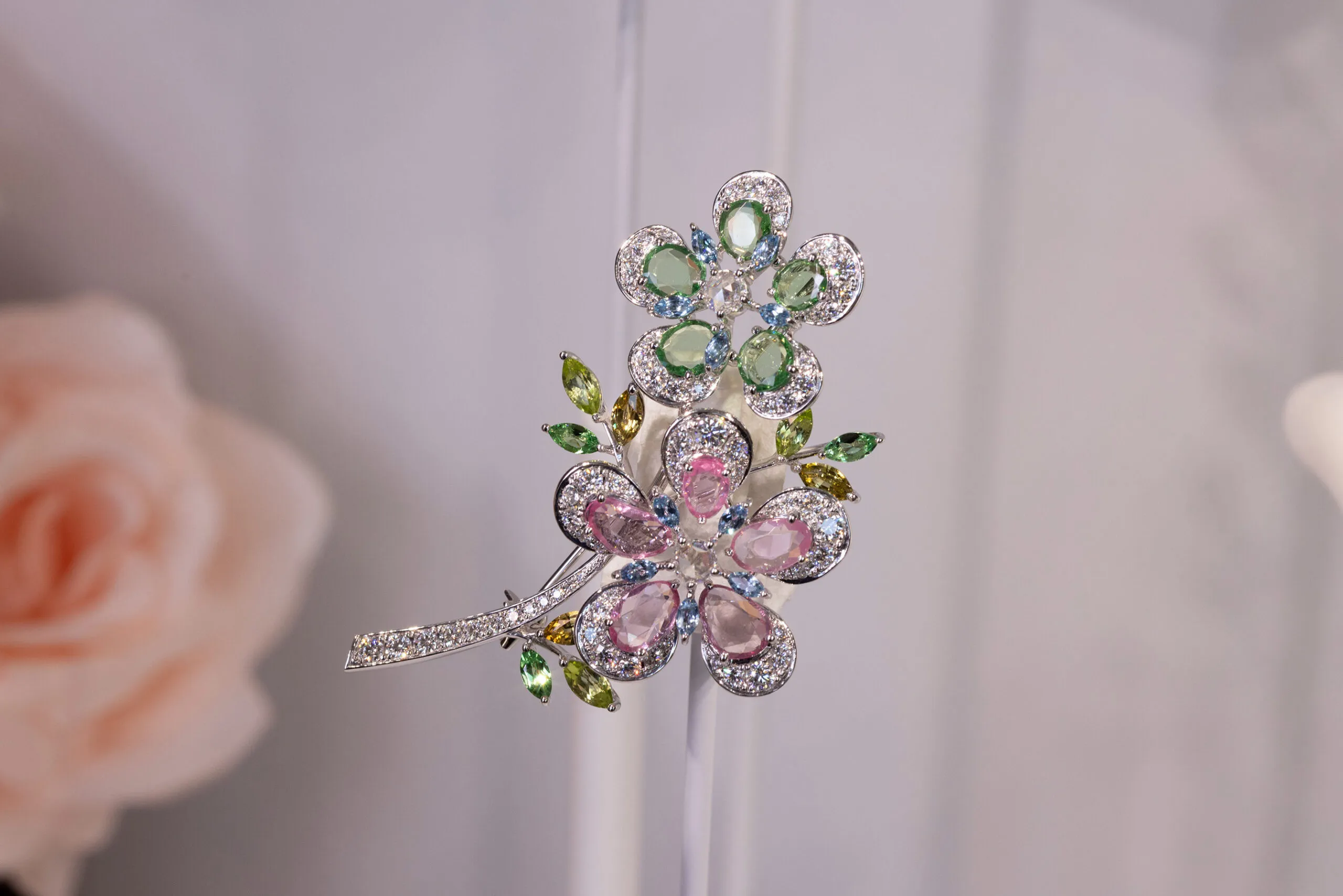 <p>Mikimoto brooch with 2.59 carats of spinel, 2.14 carats of garnet, aquamarine, peridot, tourmaline, and 1.98 carats of diamond, set in 18k white gold </p>