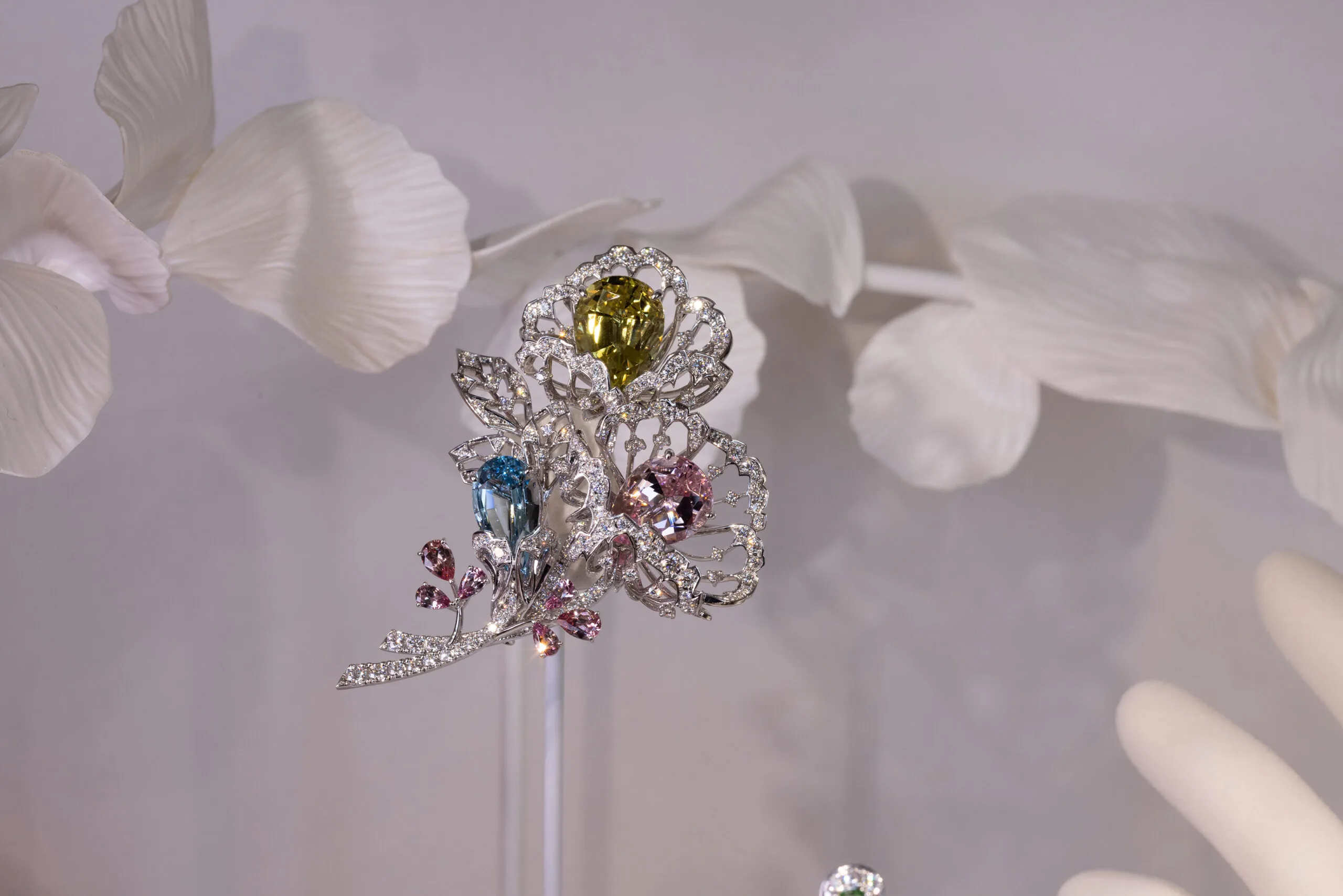 <p>Mikimoto brooch with 8.17 carats of yellow beryl, 6.61 carats of morganite, 5.35 carats of aquamarine, garnets and diamonds set in 18k white gold </p>