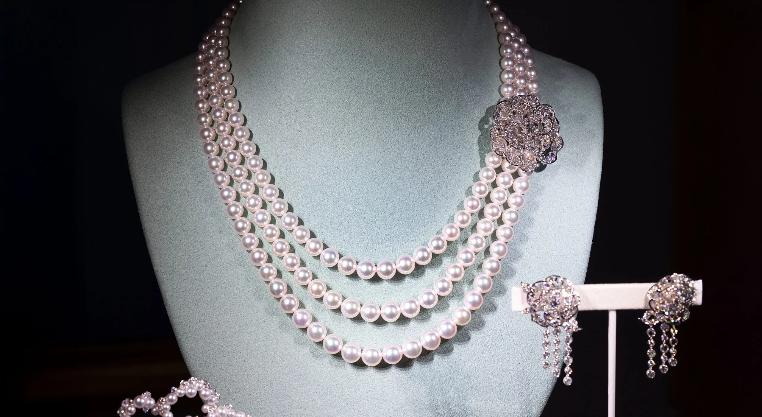<p>Mikimoto Blooming Delight necklace with Akoya cultured pearls and 6.24 carats of diamonds alongside the matching earrings with Akoya cultured pearls and diamonds, both in 18k white gold </p>