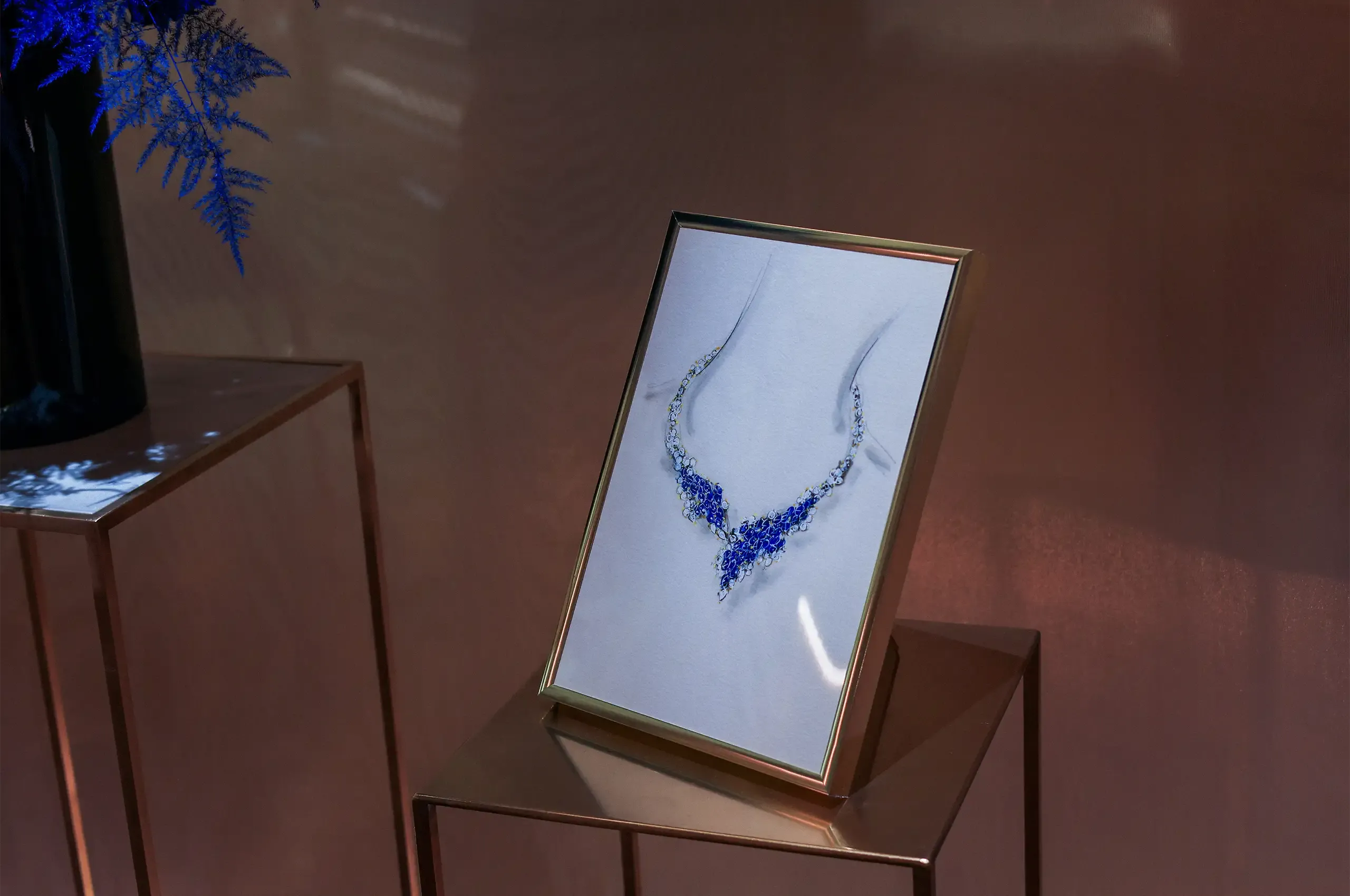 An archival gouache on display for a sapphire and diamond necklace