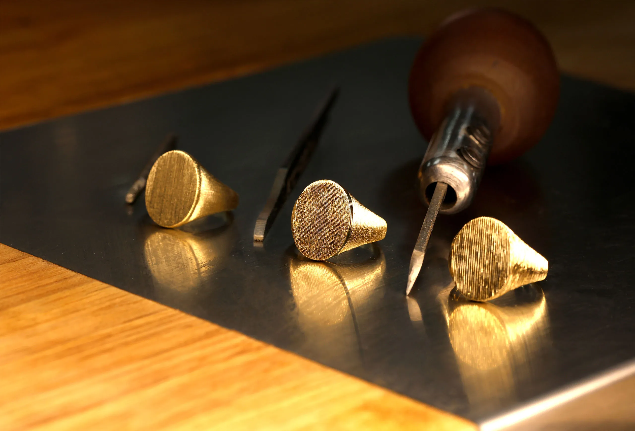 Gold rings taking form at the workbench