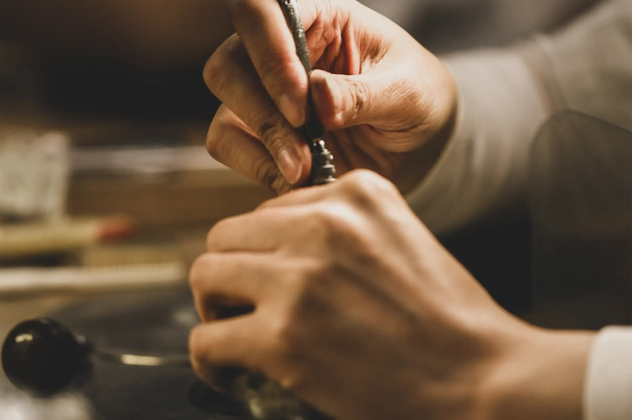 Hand-finishing a jewel at the bench