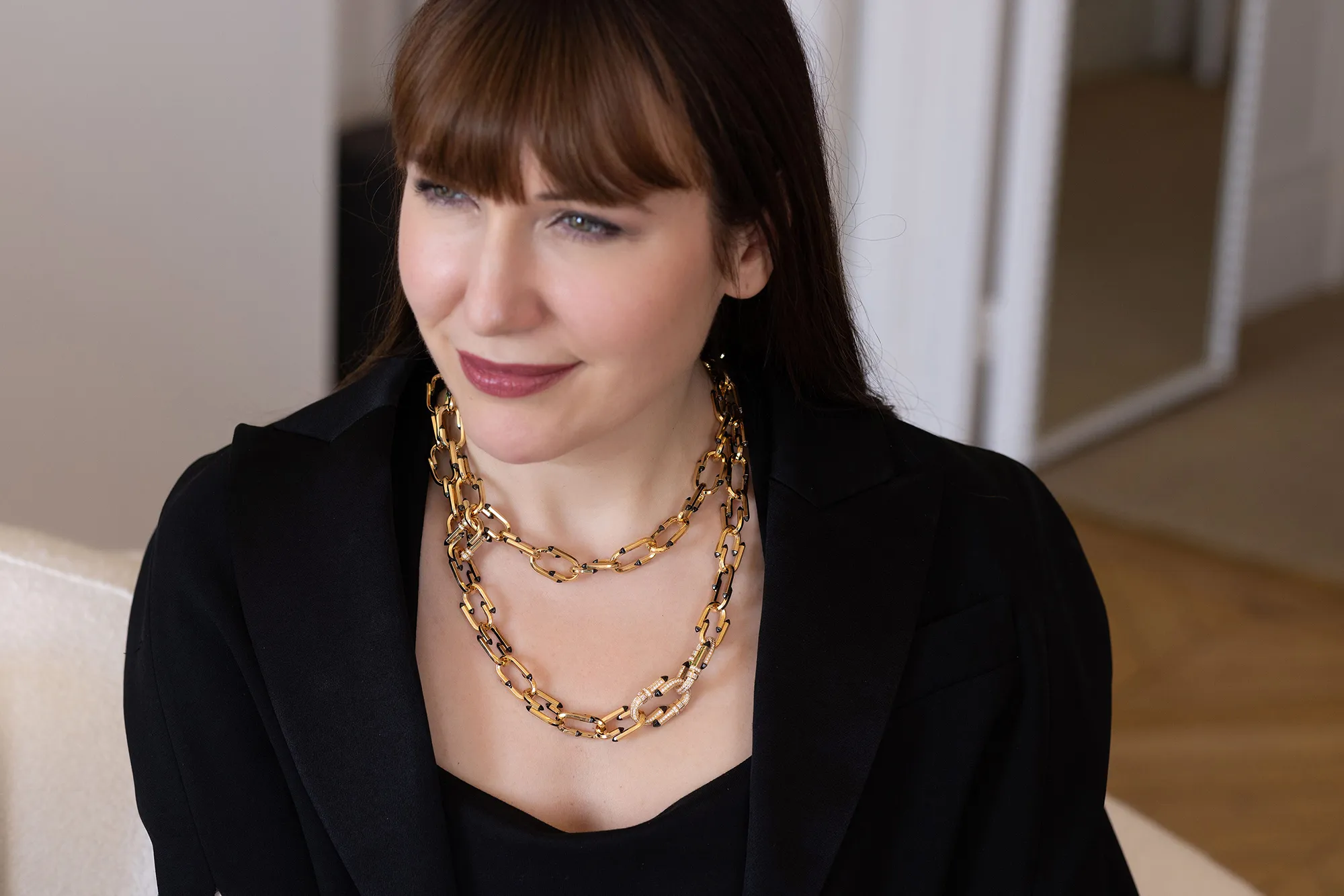 <p>Katerina Perez wears the Nouvel Héritage Try Me High Jewellery necklace with diamonds and black ceramic accents in 18k yellow gold </p>