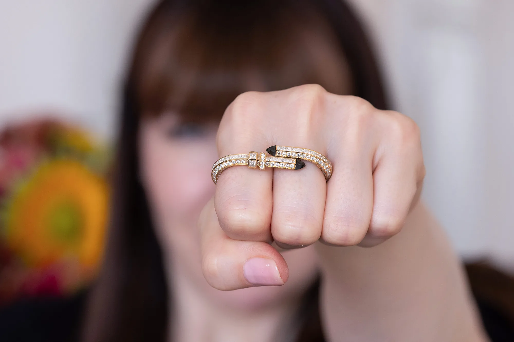 <p>Katerina Perez wears the Nouvel Héritage Try Me High Jewellery double finger ring, crafted with diamonds and black ceramic accents in 18k yellow gold </p>