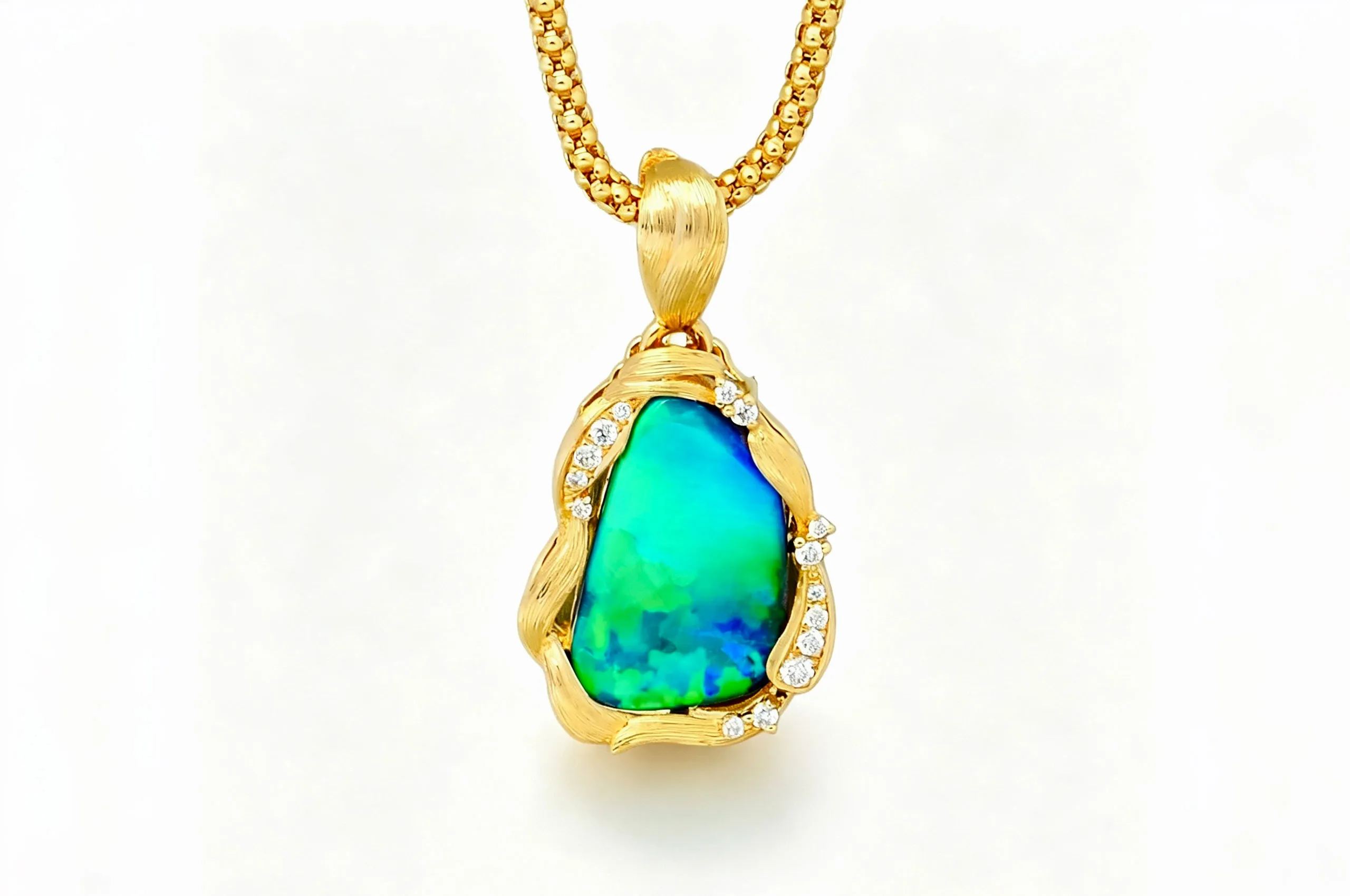 Olivia Chan Ocean Blue opal pendant with a 3.90 carat Australian boulder opal accented with natural diamonds and sculptural details in 18k yellow gold 