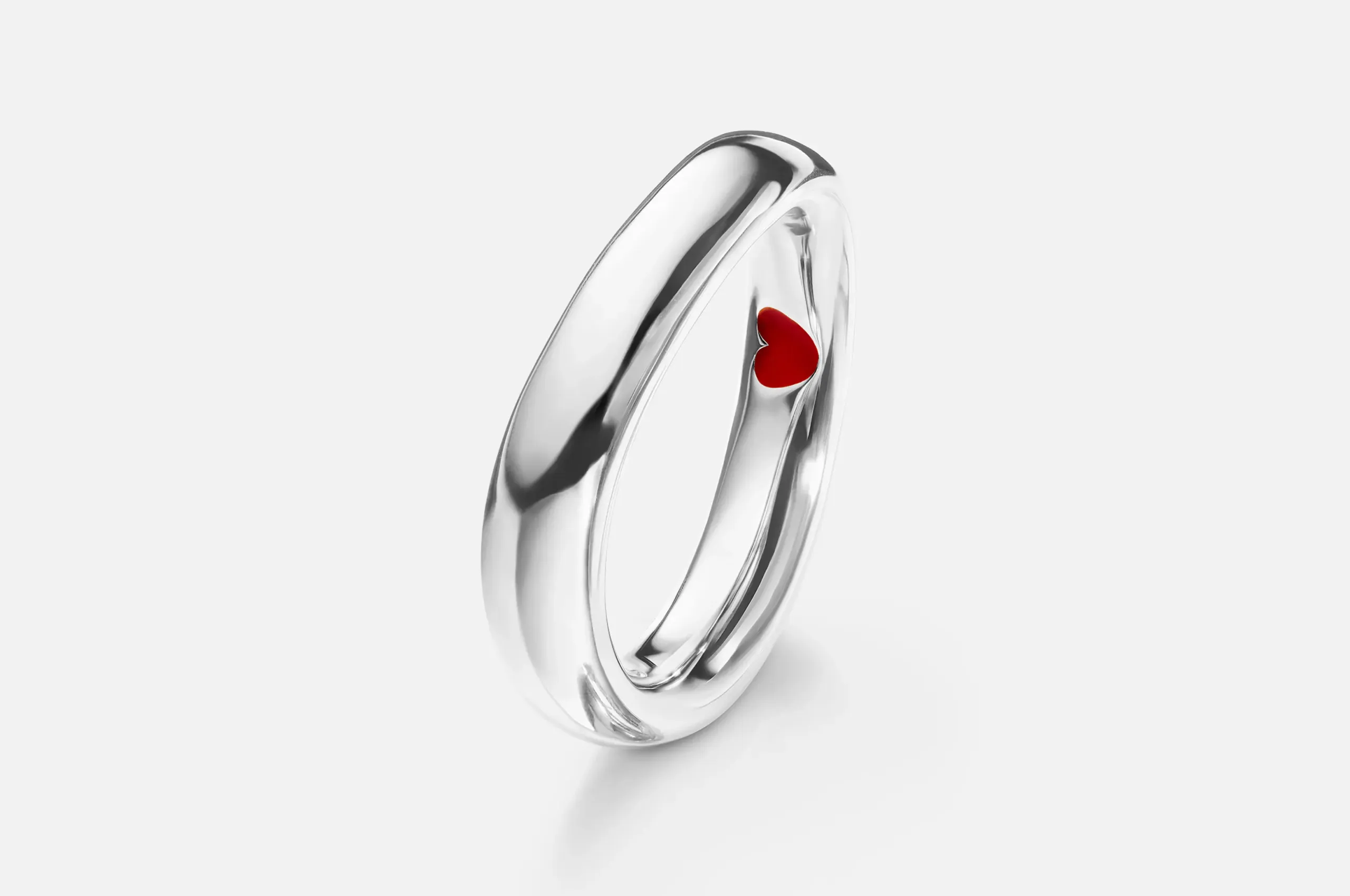 <p>Ole Lynngard’s Love ring in 18K white gold is pleasingly asymmetric, with an enamel heart concealed on the inside.</p>