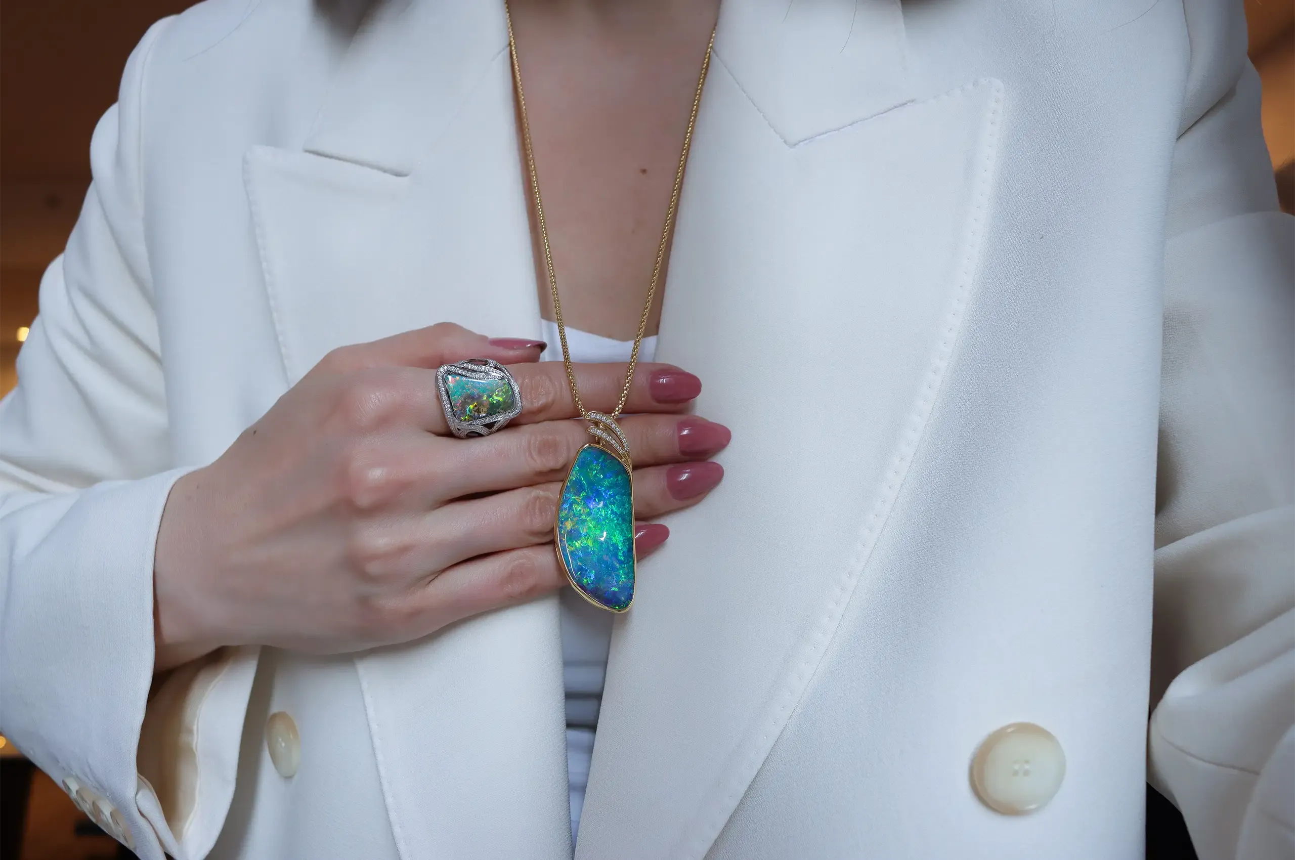 The elongated form of a 65.23-carat Australian boulder opal determined the design of this one-of-a-kind Olivia Chan pendant