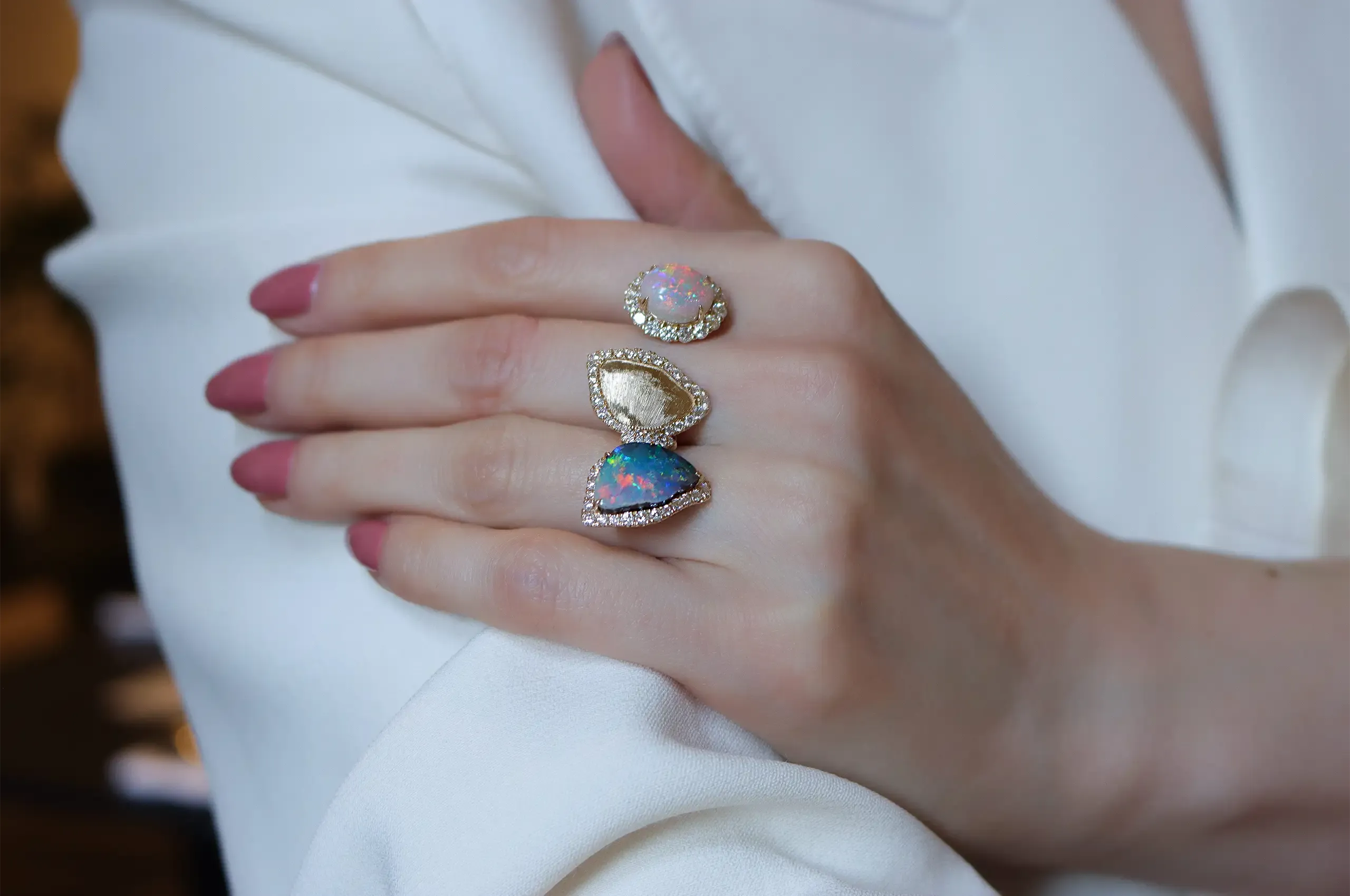 Olivia Chan pairs a 5-carat boulder opal with a 3.5-carat black opal in this playful two-finger butterfly ring