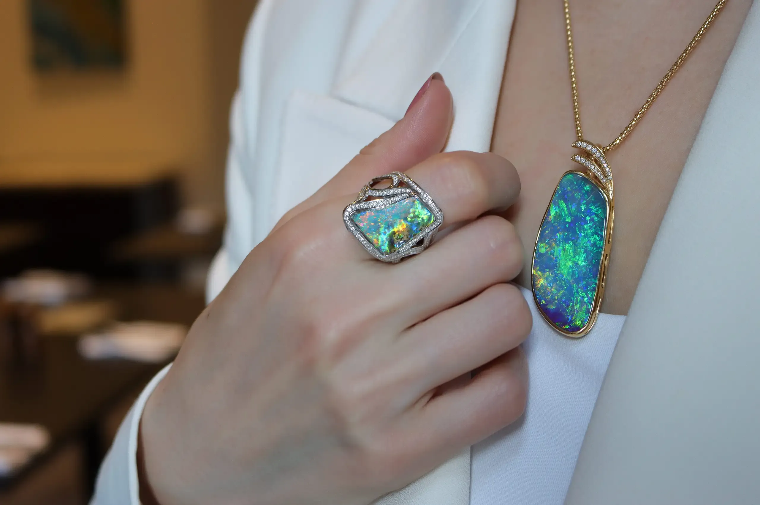 Katerina wears a 65.23-carat Australian boulder opal pendant by Olivia Chan, paired with an 8.40-carat boulder opal and diamond ring