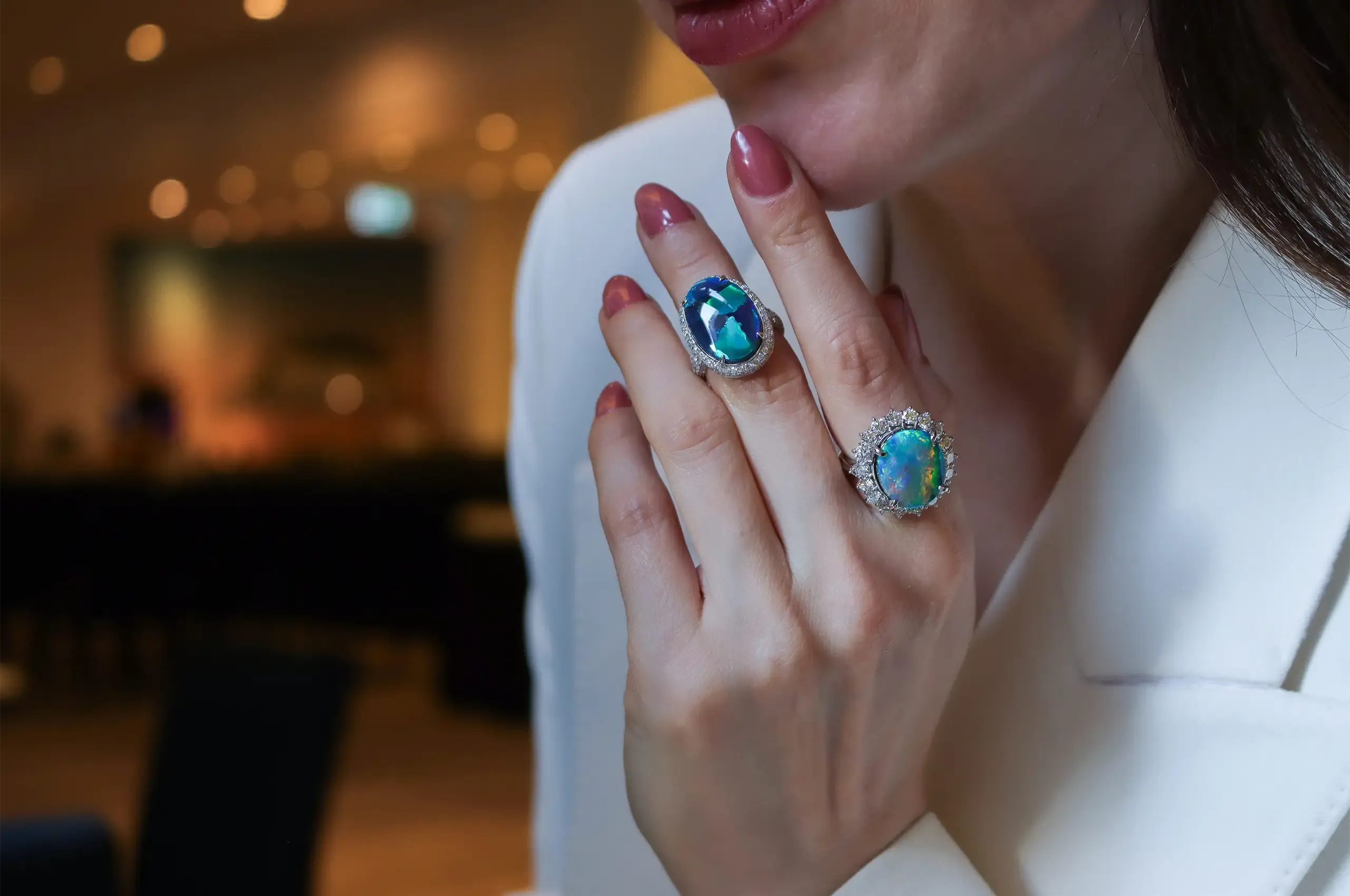Two very different Australian black opal rings by Olivia Chan, set with an 8.21-carat Flagstone opal that reminded Katerina of an abstract painting (left) and a 7.86-carat oval opal