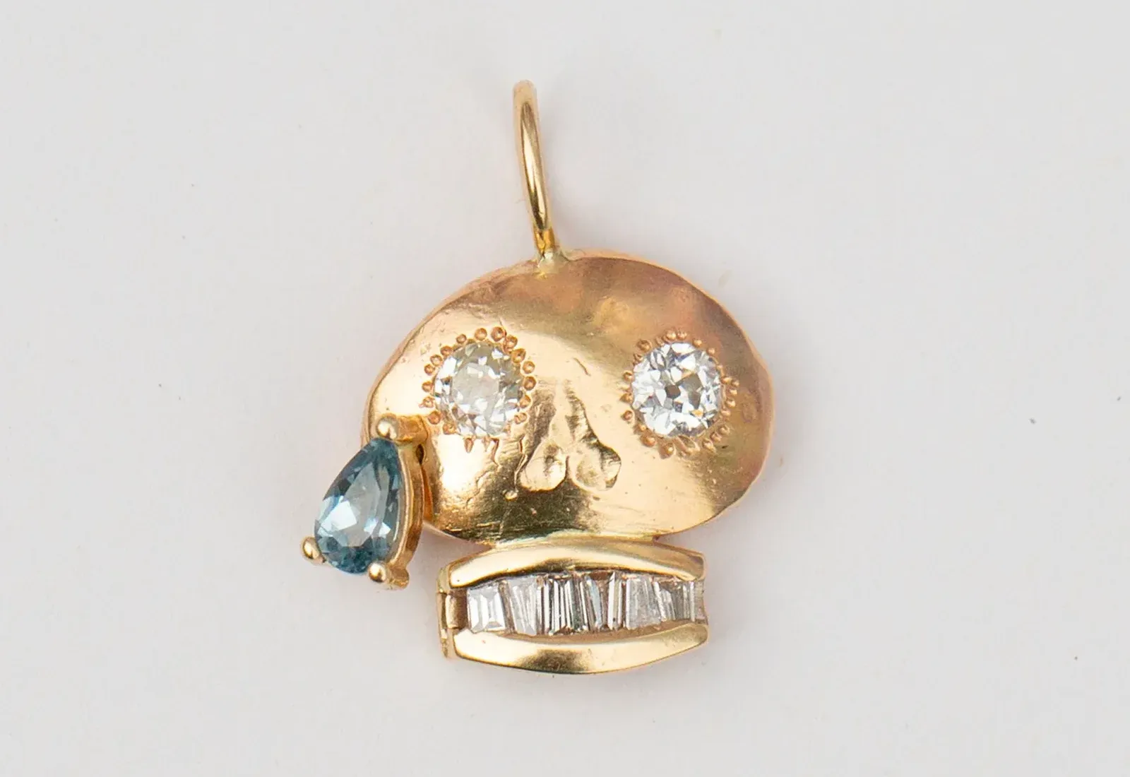 Oxbow Designs Old Soul 12 pendant in 14K yellow gold set with reclaimed and repurposed diamonds and a Montana blue sapphire tear