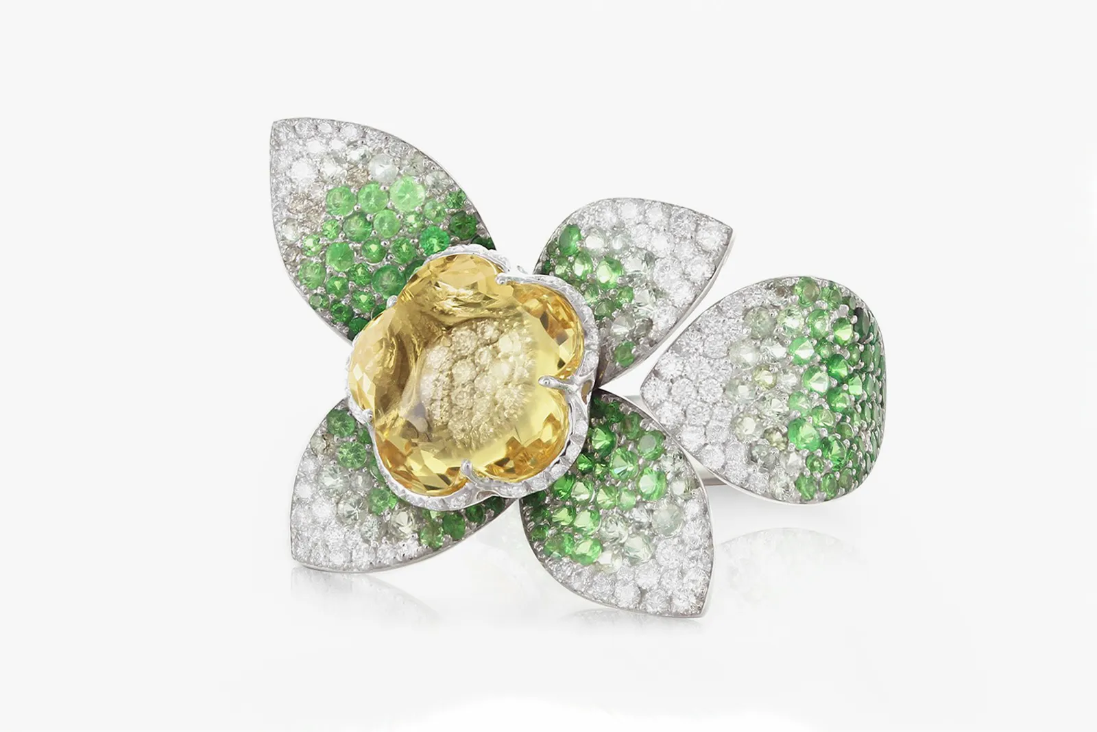 <p>Pasquale Bruni ‘Giardini Segreti’ collection ring in white gold with heliodor flower, green sapphires, tsavorites, and diamonds</p>