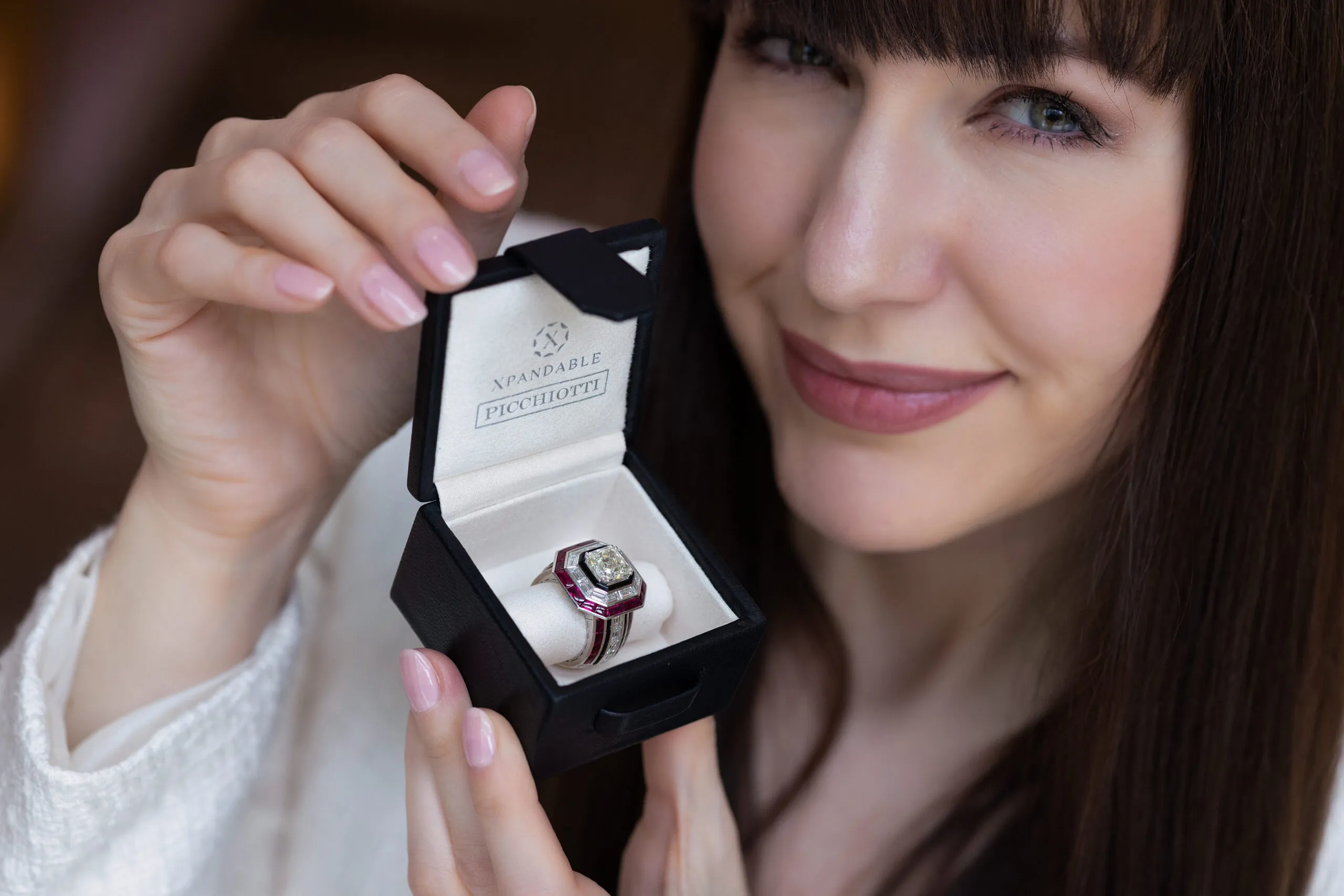<p>The Xpandable Neo Art Deco ring is set with a 4.62ct square emerald-cut diamond, 6.33ct buff-top rubies, 3.20ct baguette-cut diamonds, 1.42ct round diamonds and black onyx</p>
