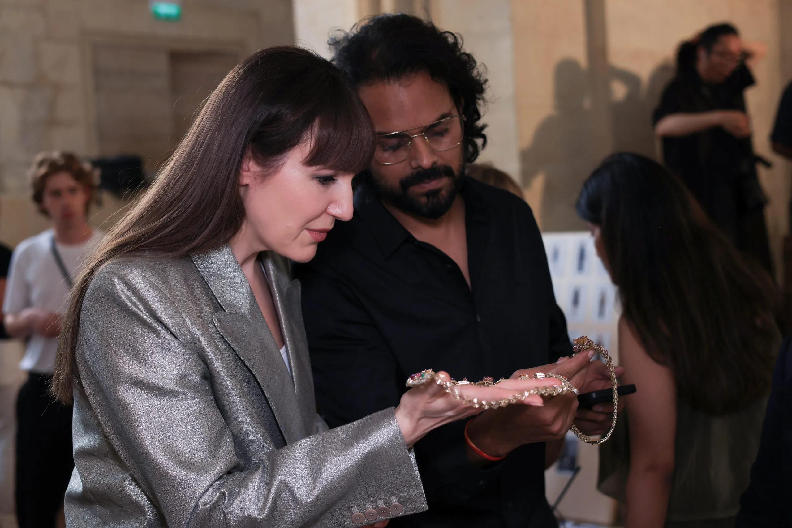 Rahul Mishra talks through one of his designs with Katerina