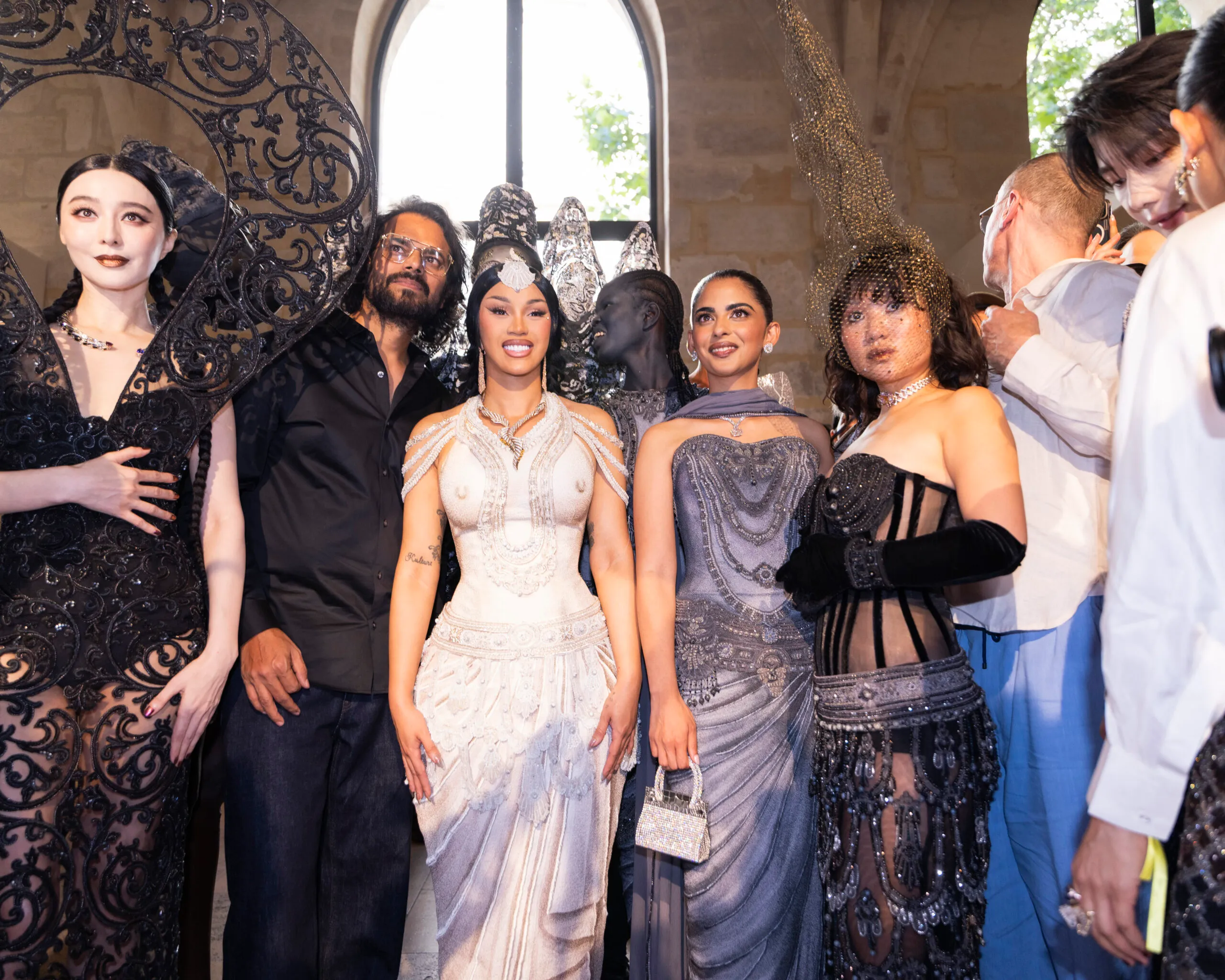 Guests at Rahul Mishra's Fall Winter 2026 show in Paris, including, left to right, Fan Bingbing, Cardi B, Isha Ambani and Rei Ami. Photo by Valerio Mezzanotti