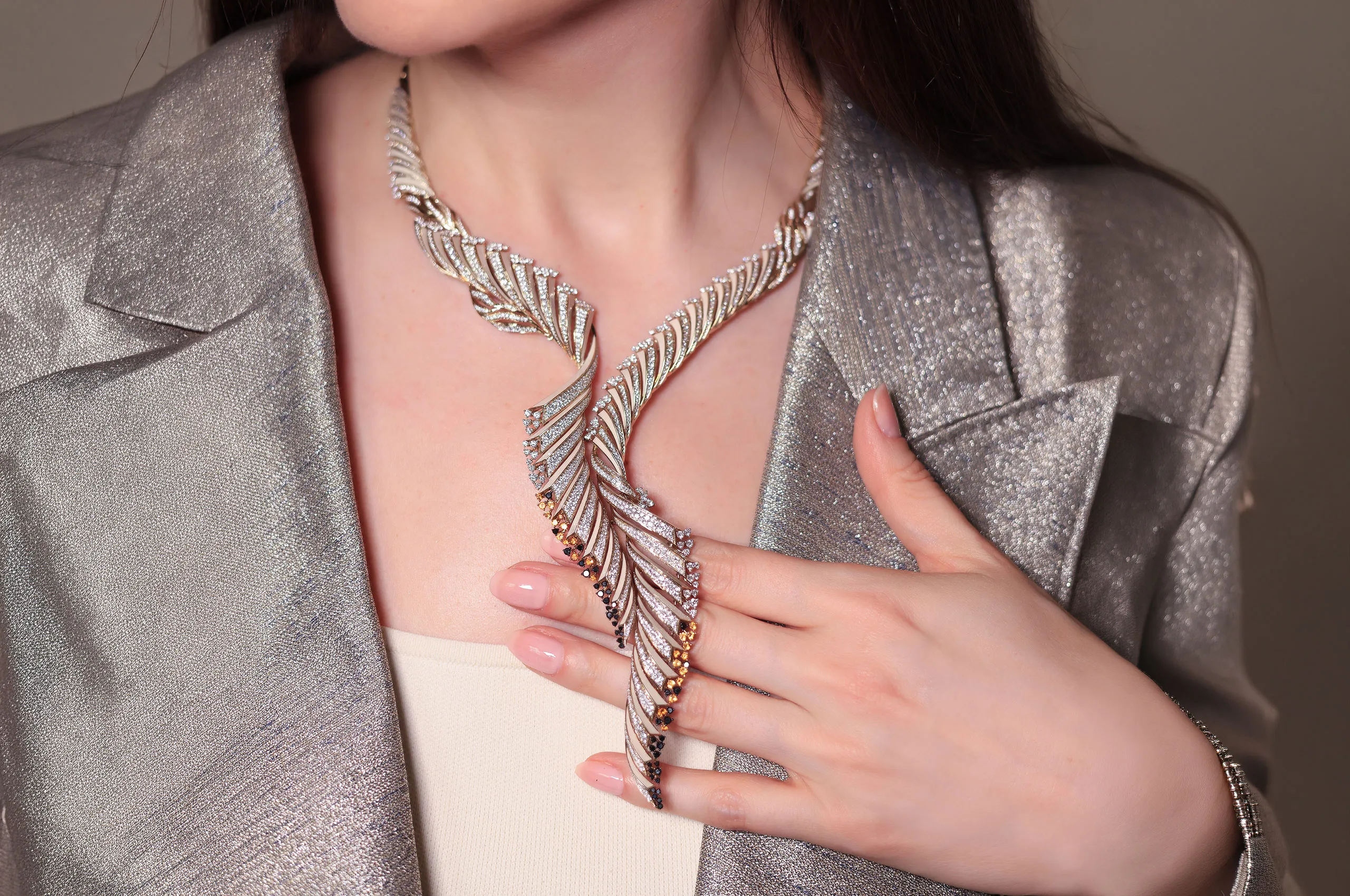 Though sculptural in scale, the necklace is remarkably fluid, with its articulated construction allowing it to drape naturally along the neckline